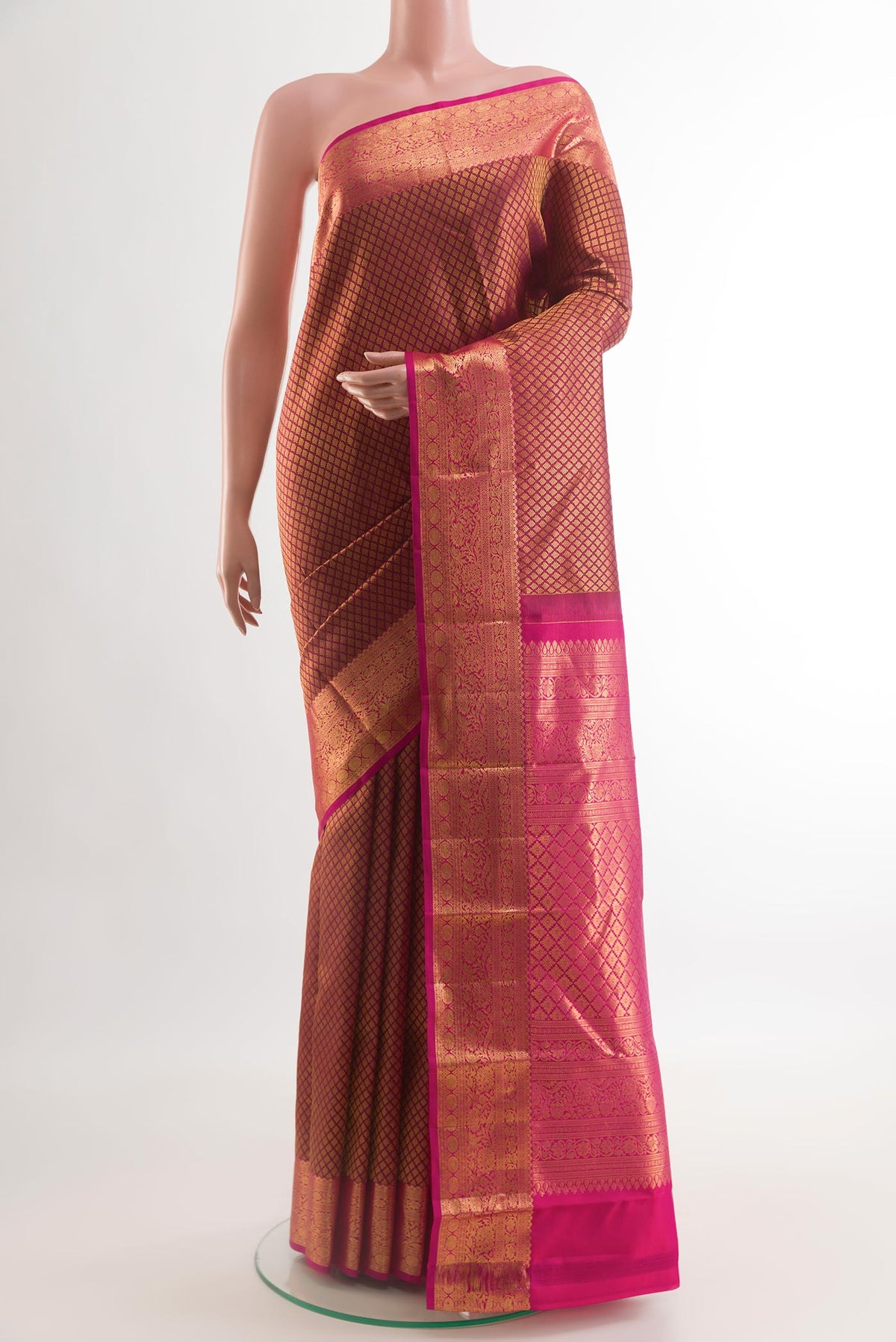 Maroon Kanjivaram Silk Saree with Zari Brocade on the body and Zari Border.  displayed on a mannequin