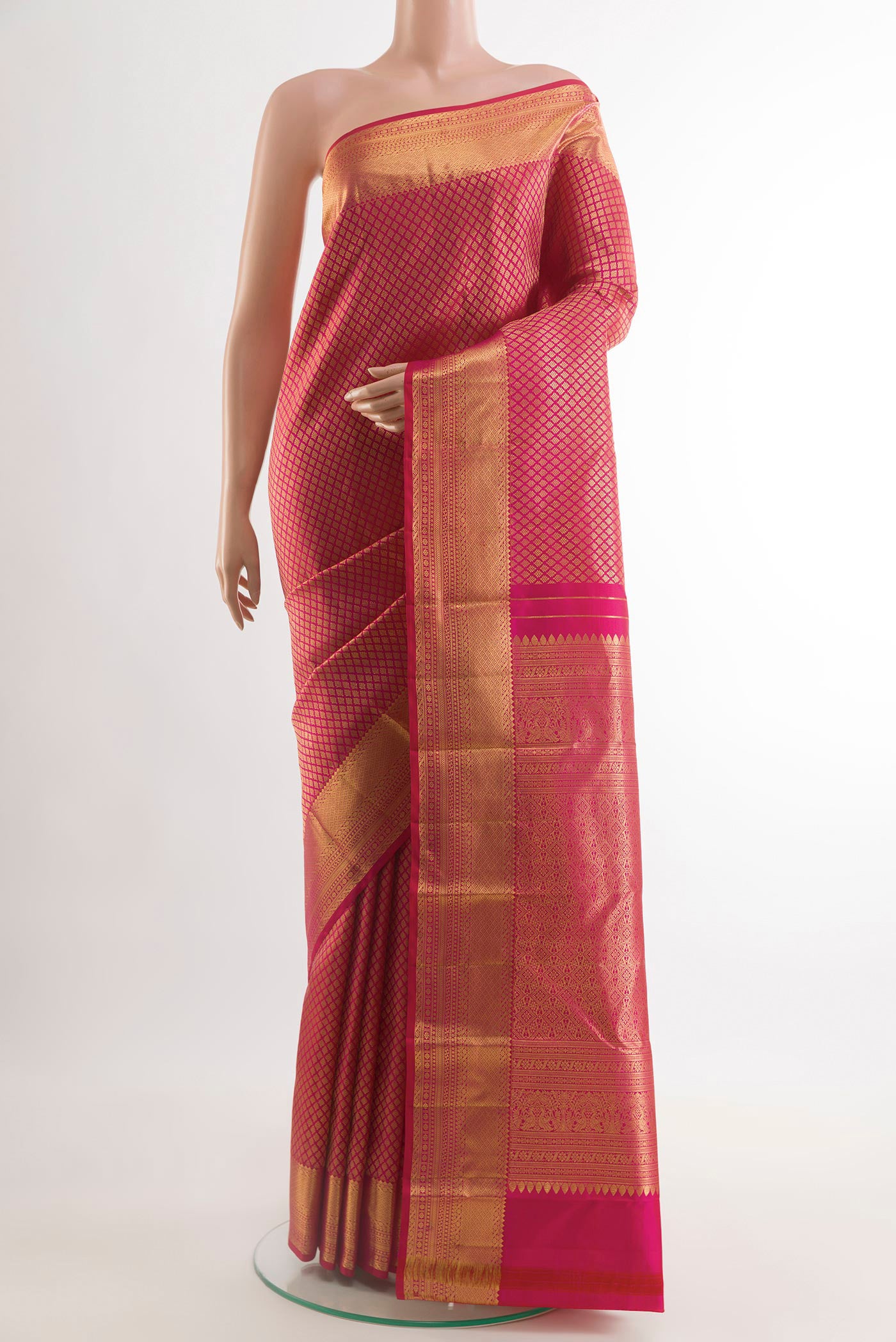 Pink Kanjivaram Silk Saree with Zari Brocade on the body and Zari Border.  displayed on a mannequin