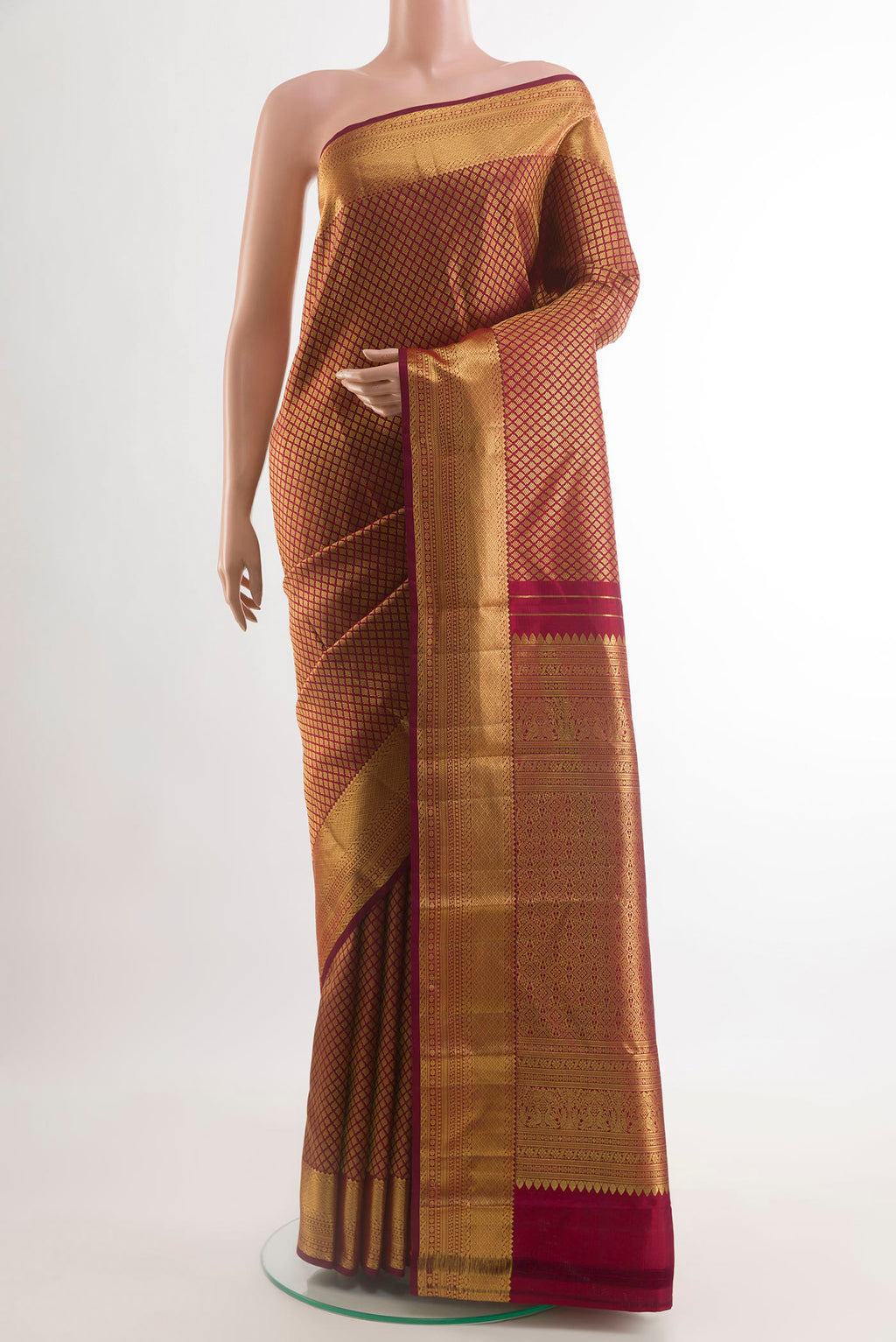 Maroon Kanjivaram Silk Saree with Zari Brocade on the body and Zari Border.  displayed on a mannequin