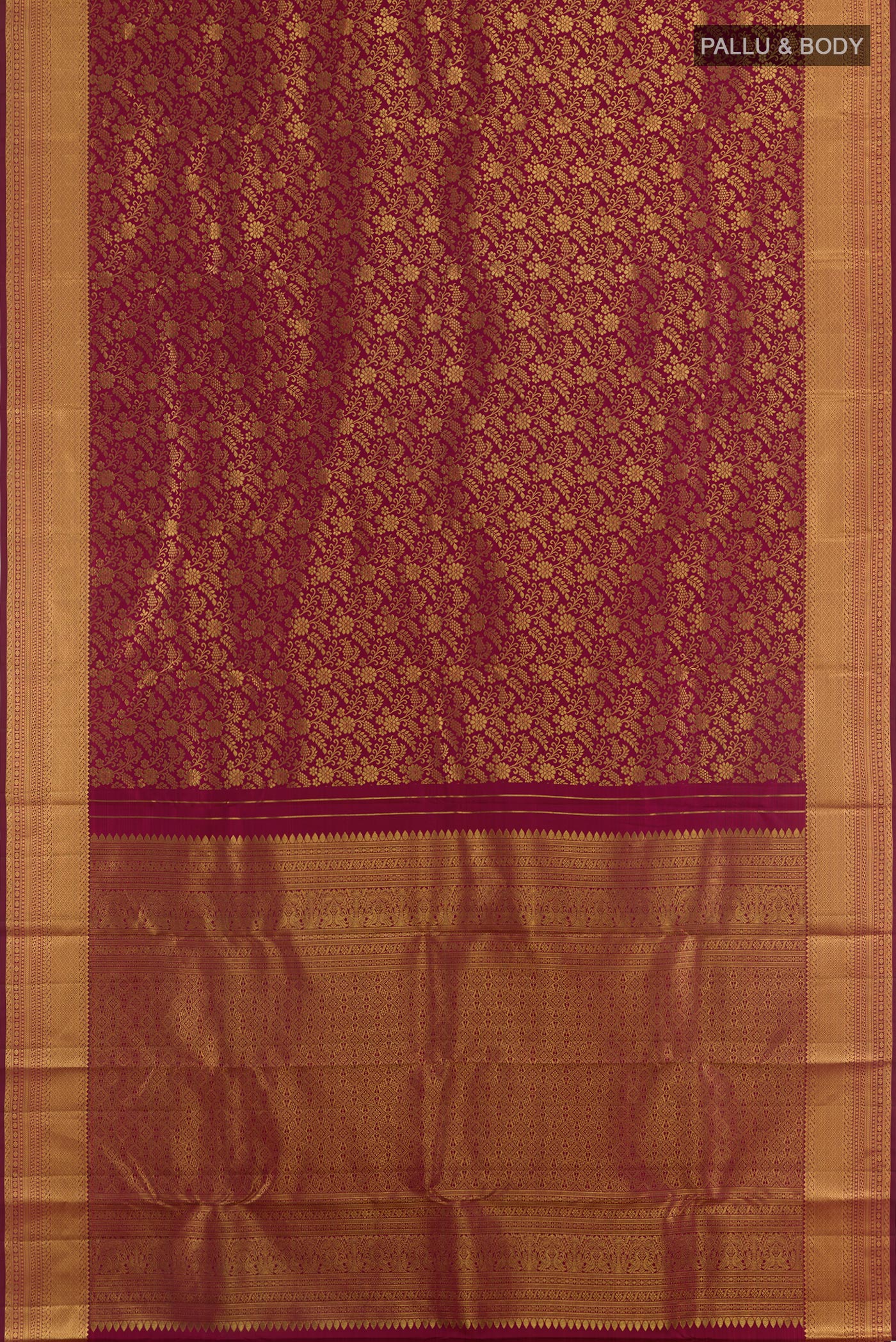 Flat view of Maroon Kanjivaram Silk Saree with Zari Brocade on the body and Zari Border. 