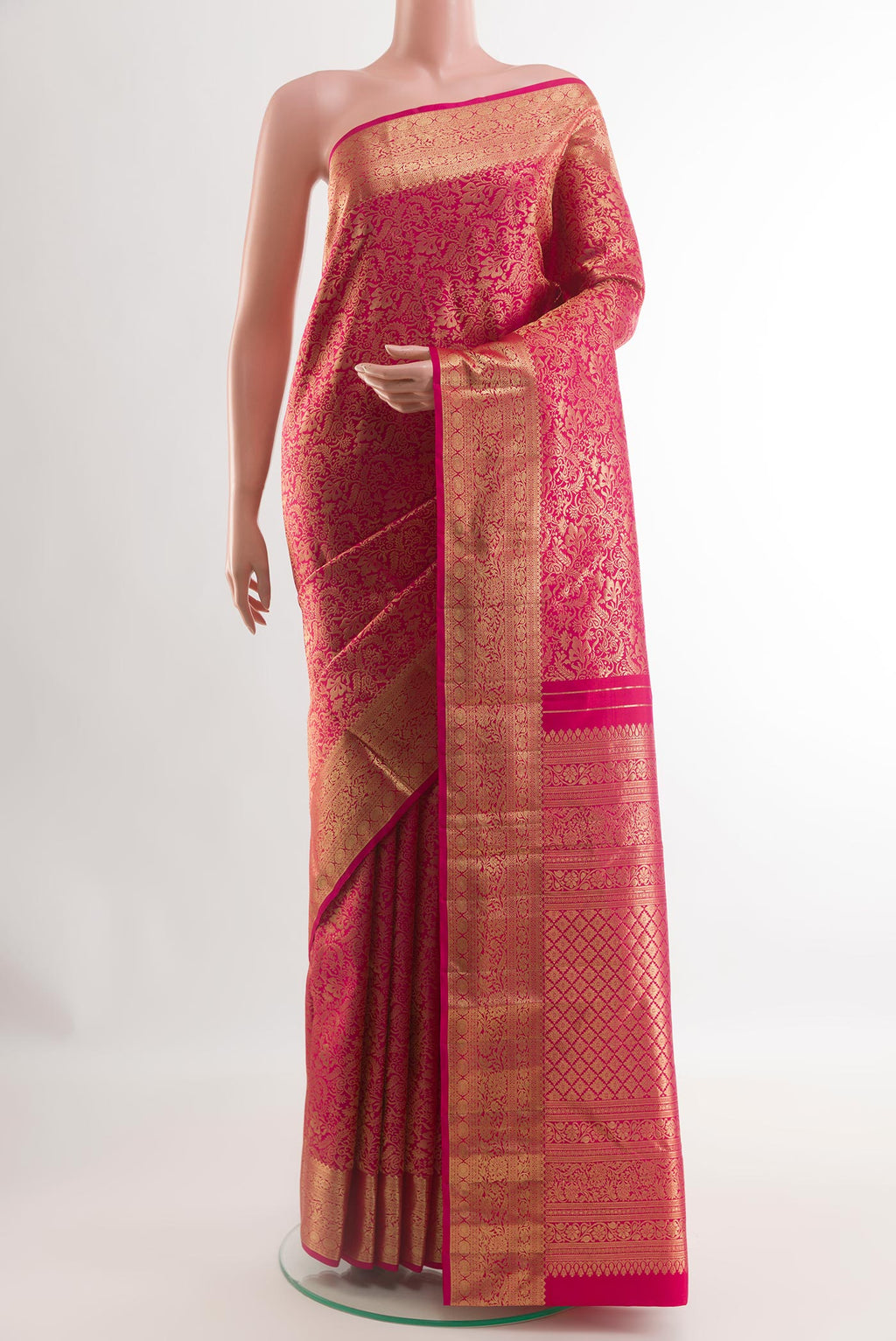 Pink Kanjivaram Silk Saree with Zari Brocade on the body and Zari Border.  displayed on a mannequin