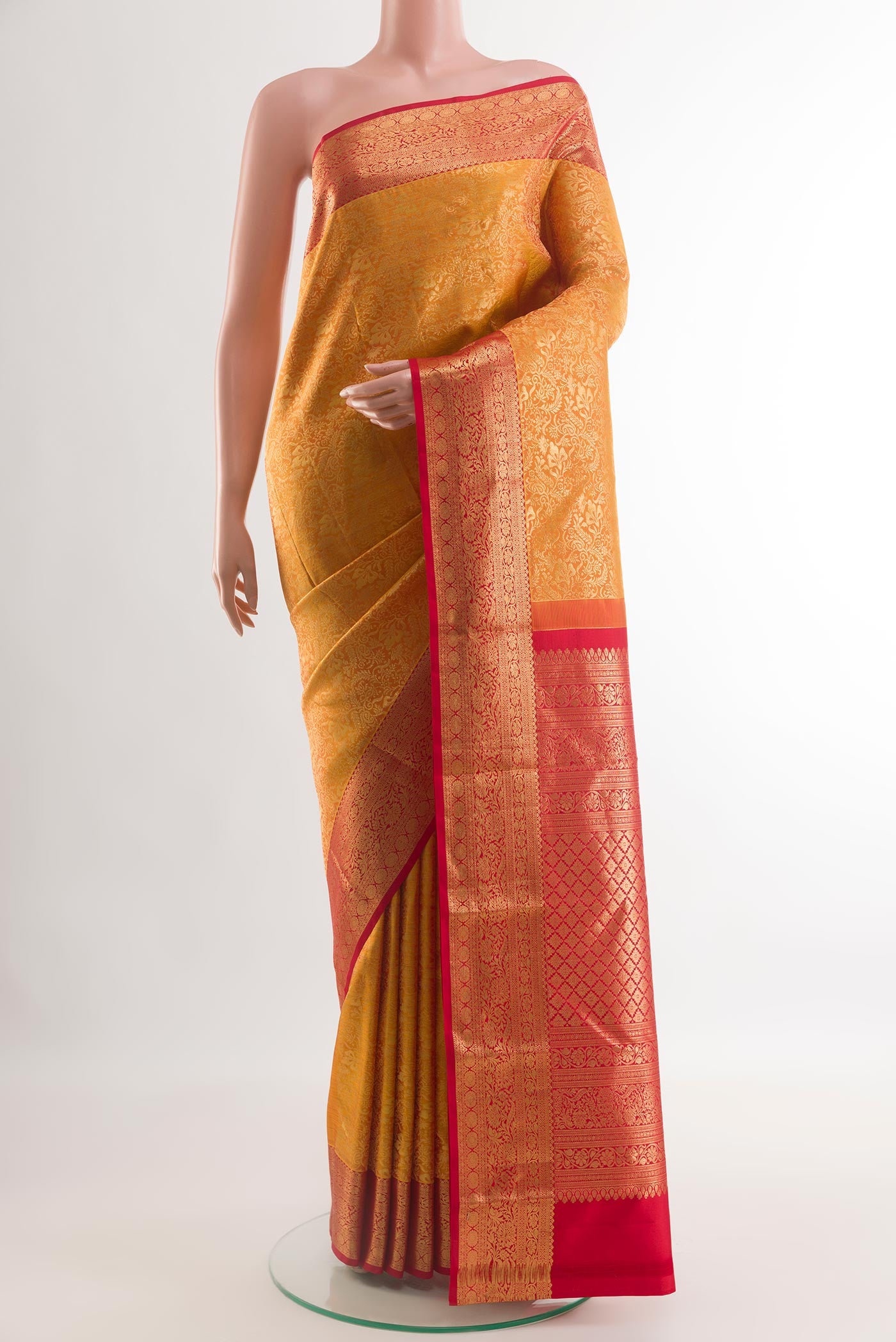 Yellow Kanjivaram Silk Saree with Zari Brocade on the body and Zari Border.  displayed on a mannequin