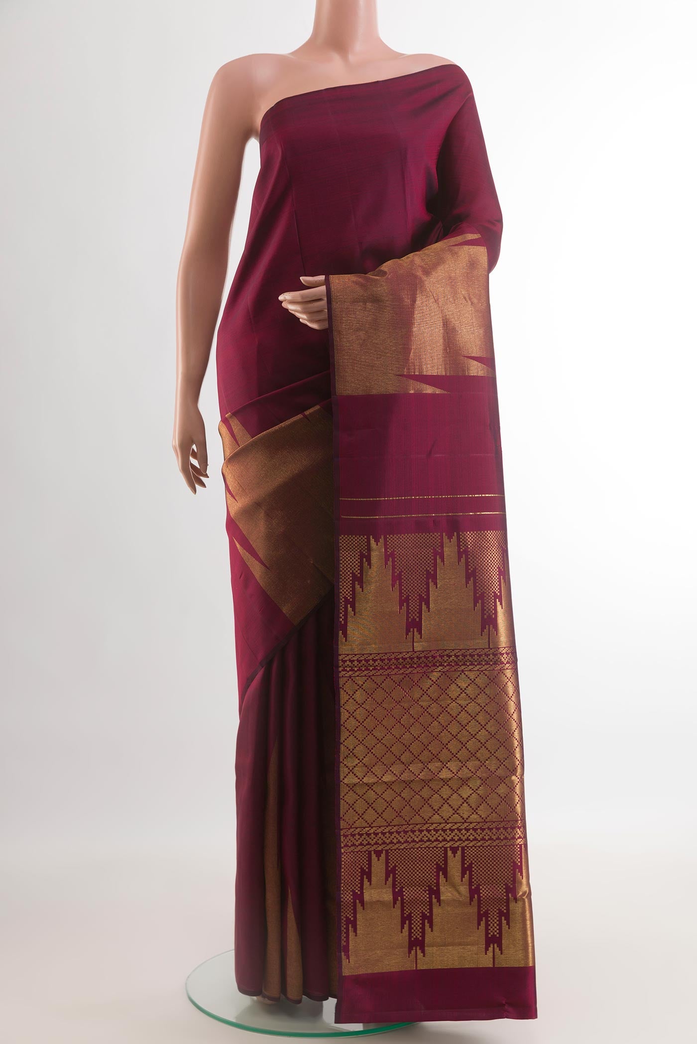 Purple Kanjivaram Silk Saree with Plain Body and Temple Border.  displayed on a mannequin