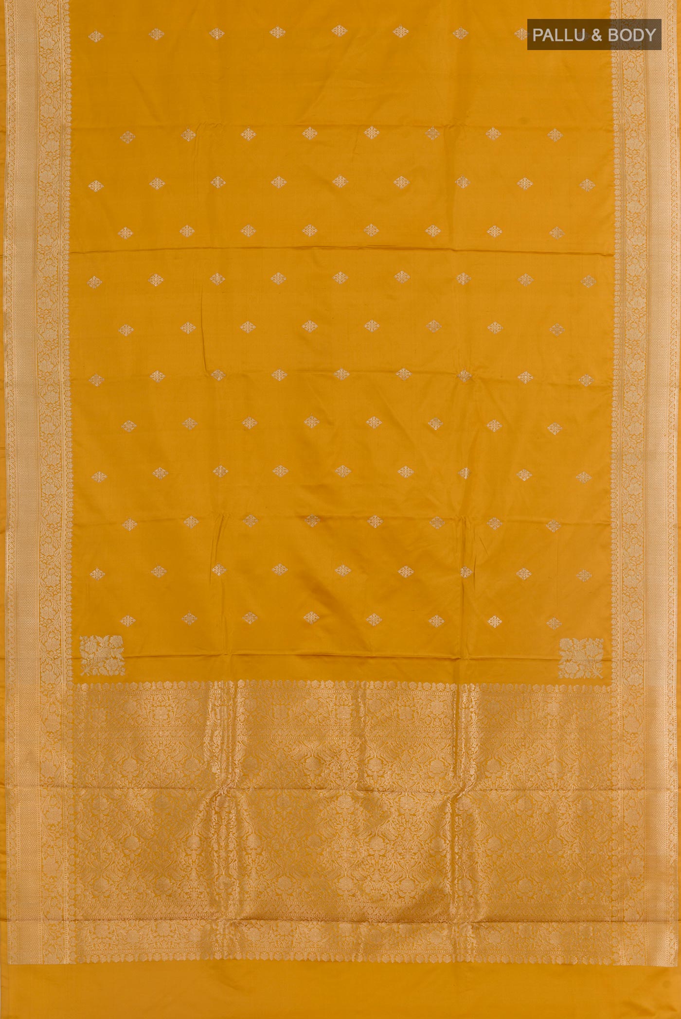 Flat view of Yellow Banarasi Silk Saree with Zari Butta on the body and Zari Border. 