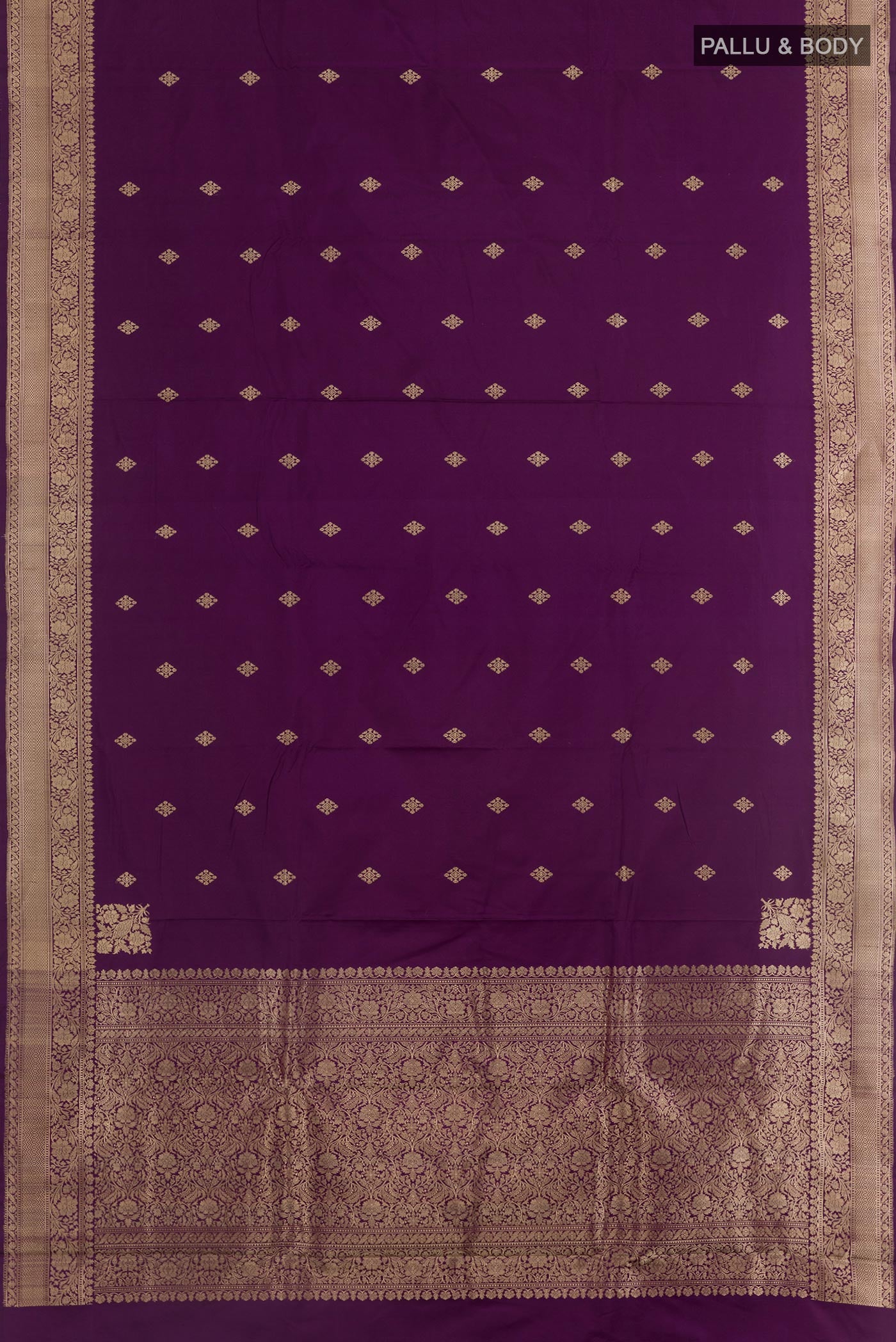 Flat view of Purple Banarasi Silk Saree with Zari Butta on the body and Zari Border. 
