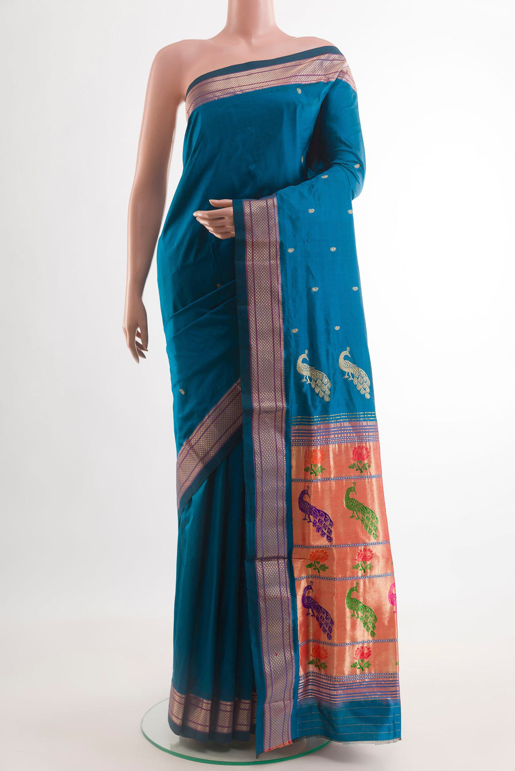 Blue Paithani Silk Saree with Zari Butta on the body and Zari Border.  displayed on a mannequin