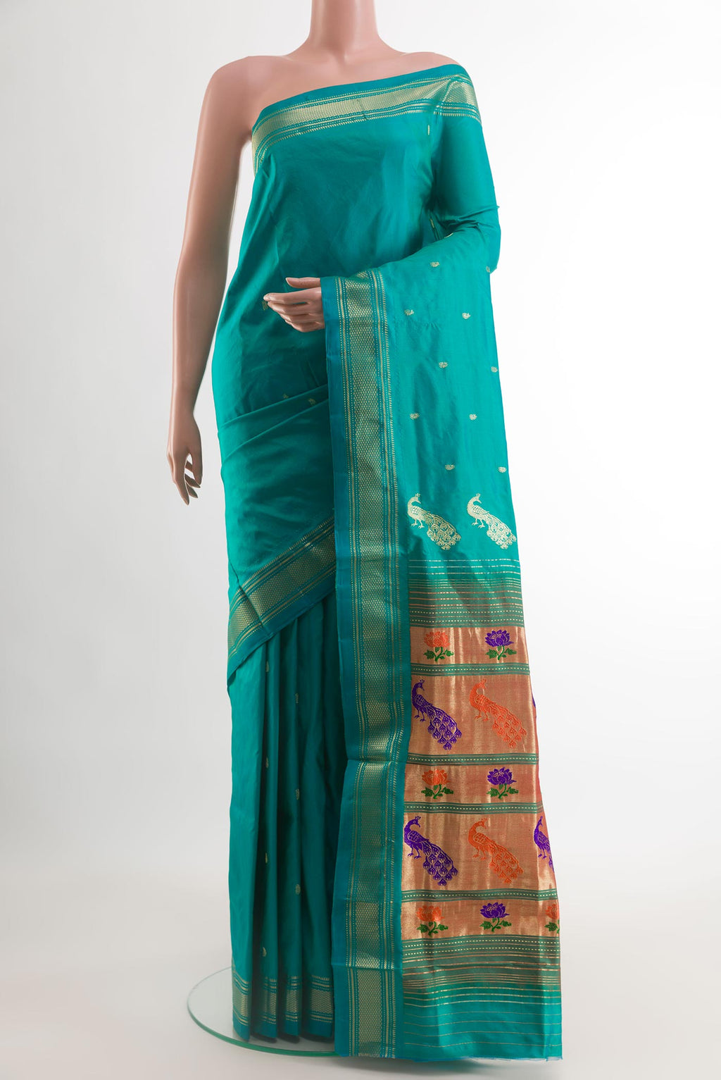 Blue Paithani Silk Saree with Zari Butta on the body and Zari Border.  displayed on a mannequin