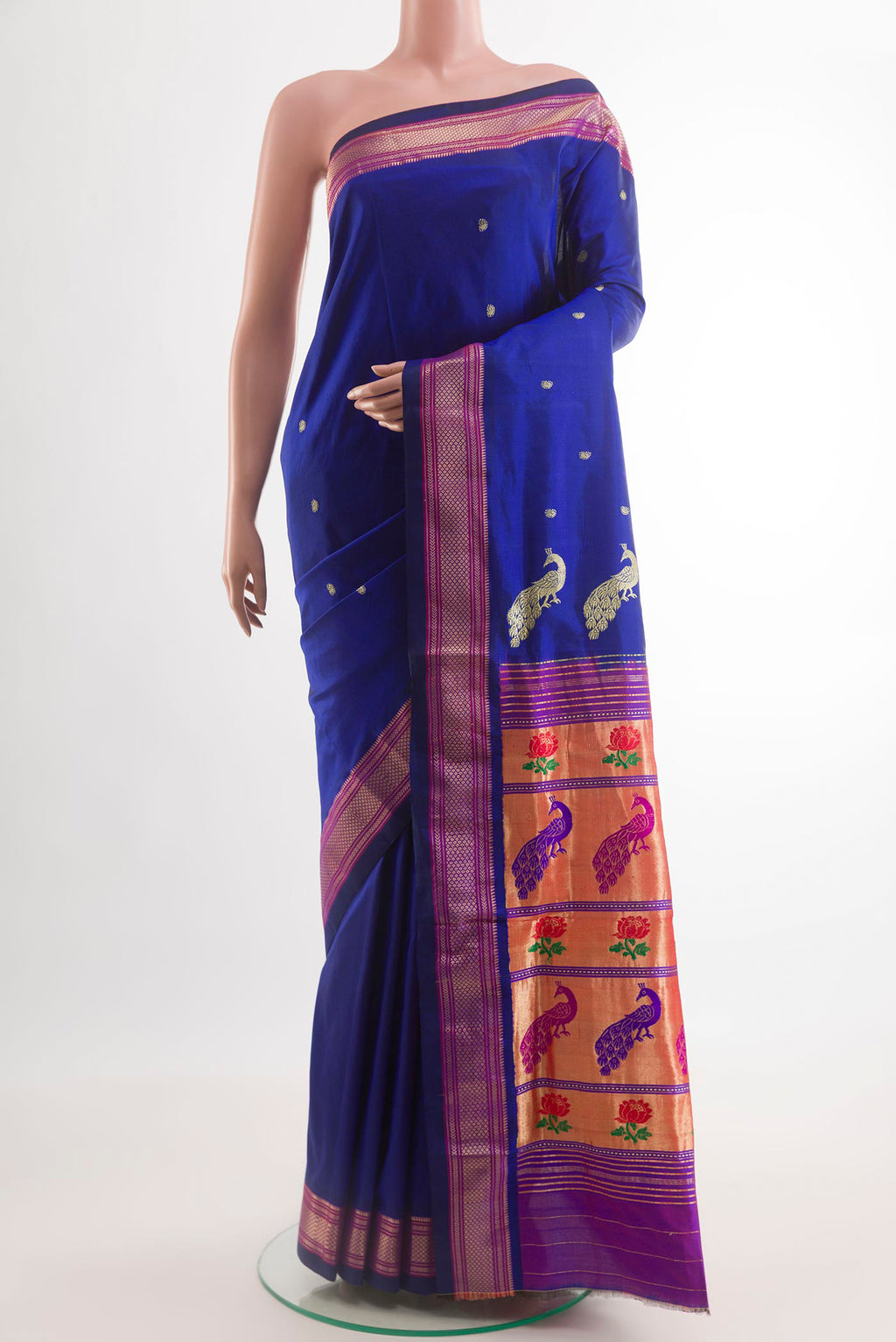 Blue Paithani Silk Saree with Zari Butta on the body and Zari Border.  displayed on a mannequin