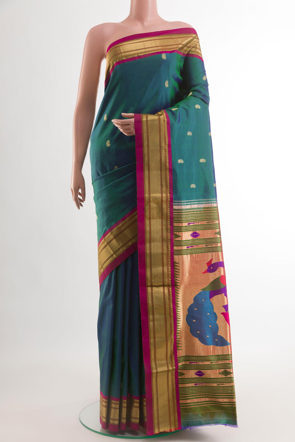 Peacock Blue Paithani Silk Saree with Zari Butta on the body and Zari Border.  displayed on a mannequin