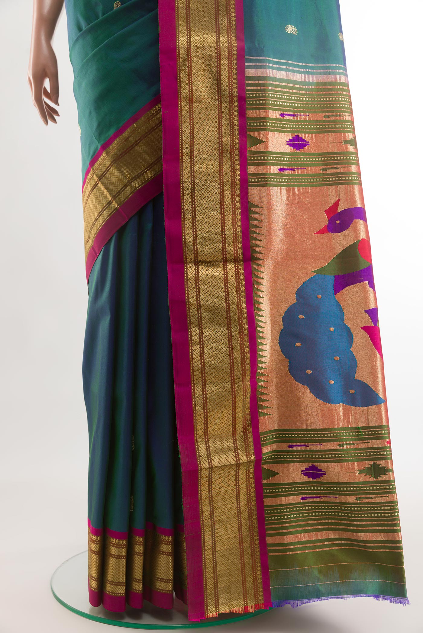 Pleats and pallu of Peacock Blue Paithani Silk Saree with Zari Butta on the body and Zari Border. 