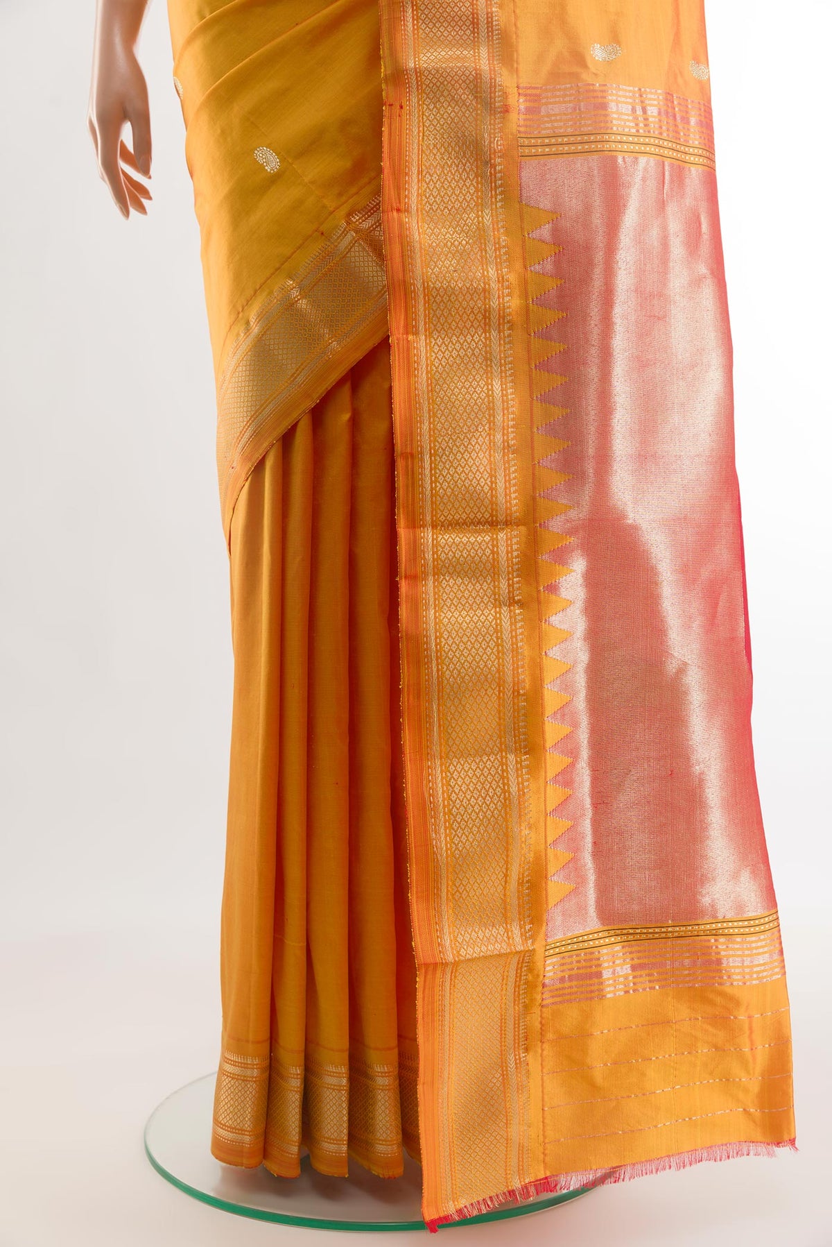 Pleats and pallu of Yellow Paithani Silk Saree with Zari Butta on the body and Zari Border. 