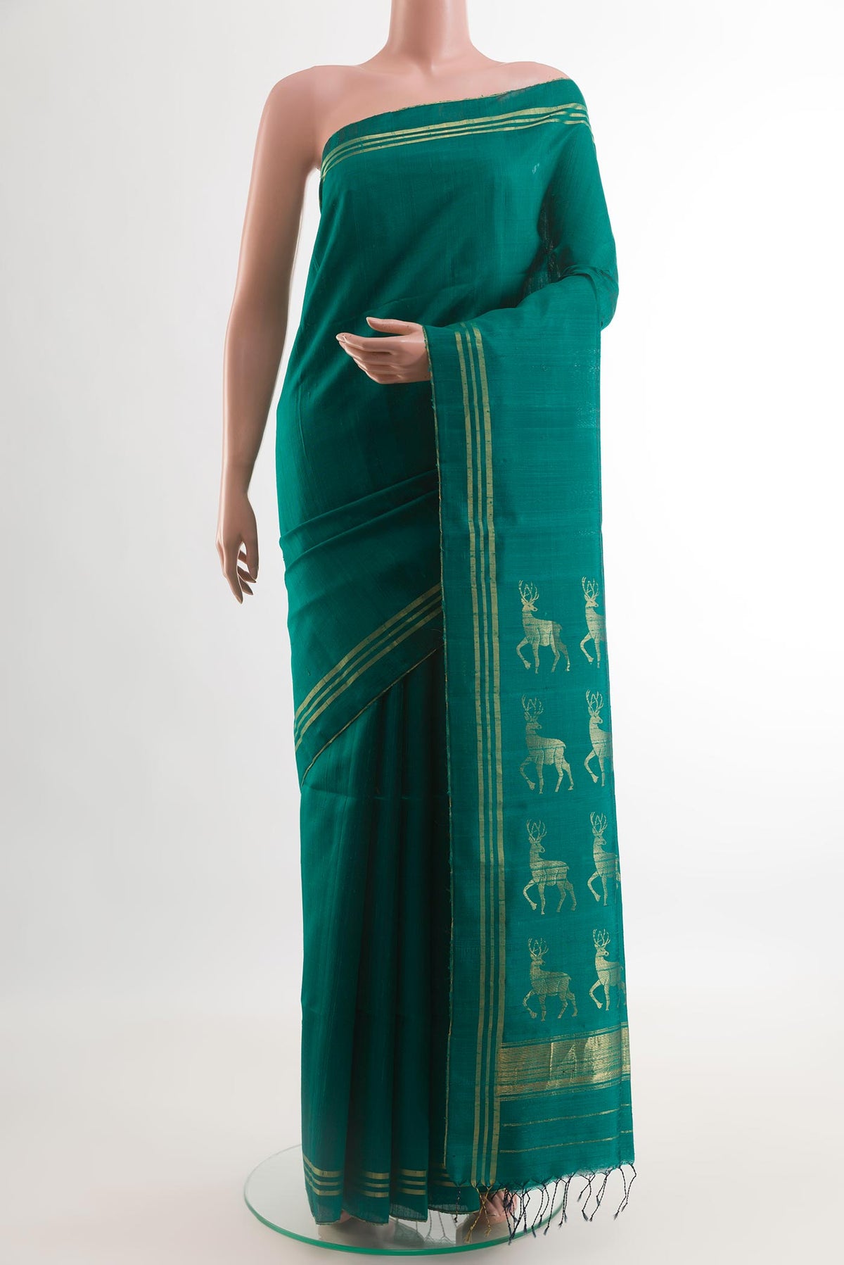 Green Raw Silk Saree with Plain Body and Plain Border.  displayed on a mannequin
