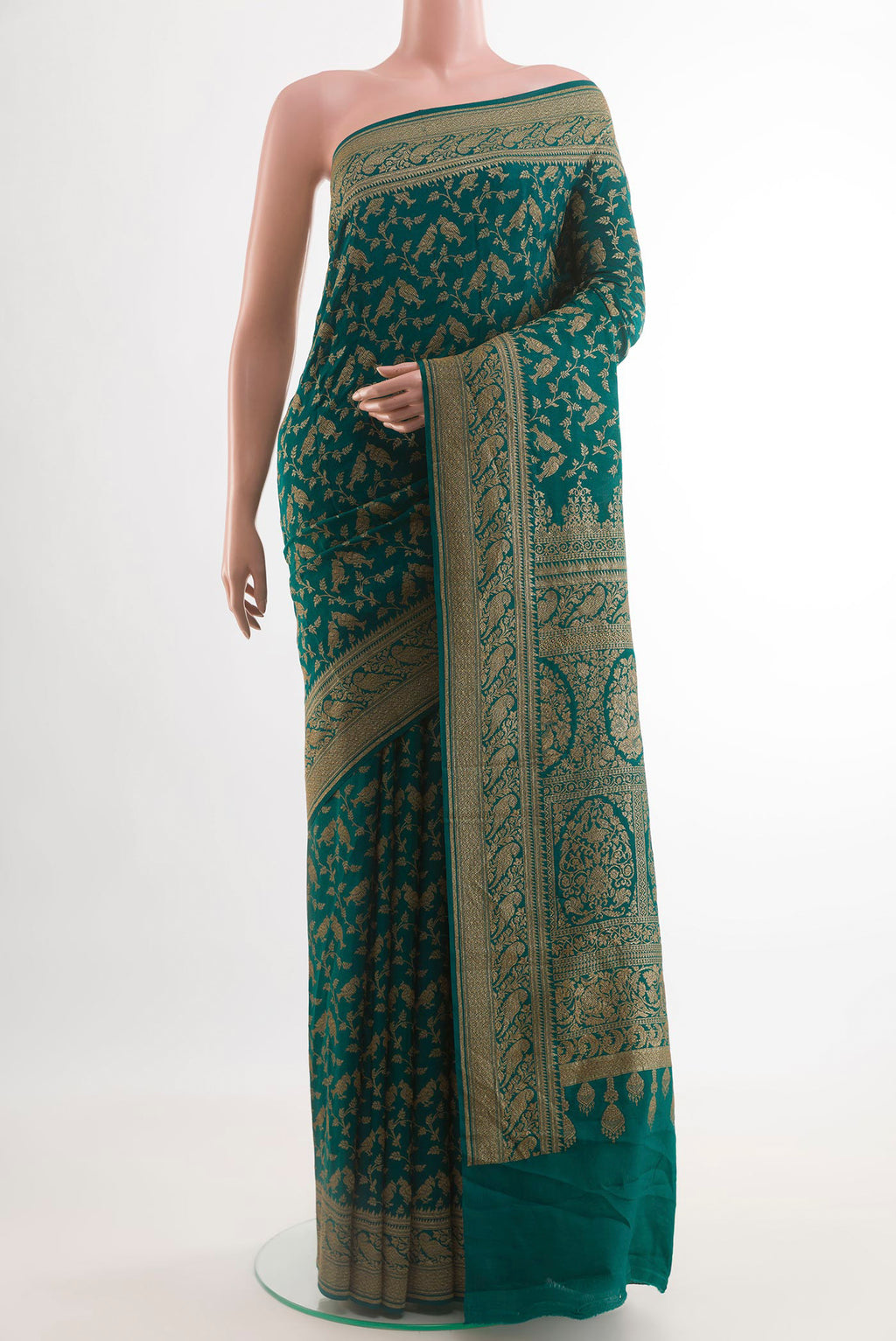 Teal Banarasi Georgette Saree with Zari Brocade on the body and Zari Border.  displayed on a mannequin