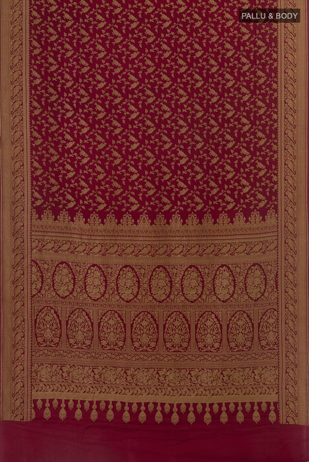 Flat view of Maroon Banarasi Georgette Saree with Zari Brocade on the body and Zari Border. 