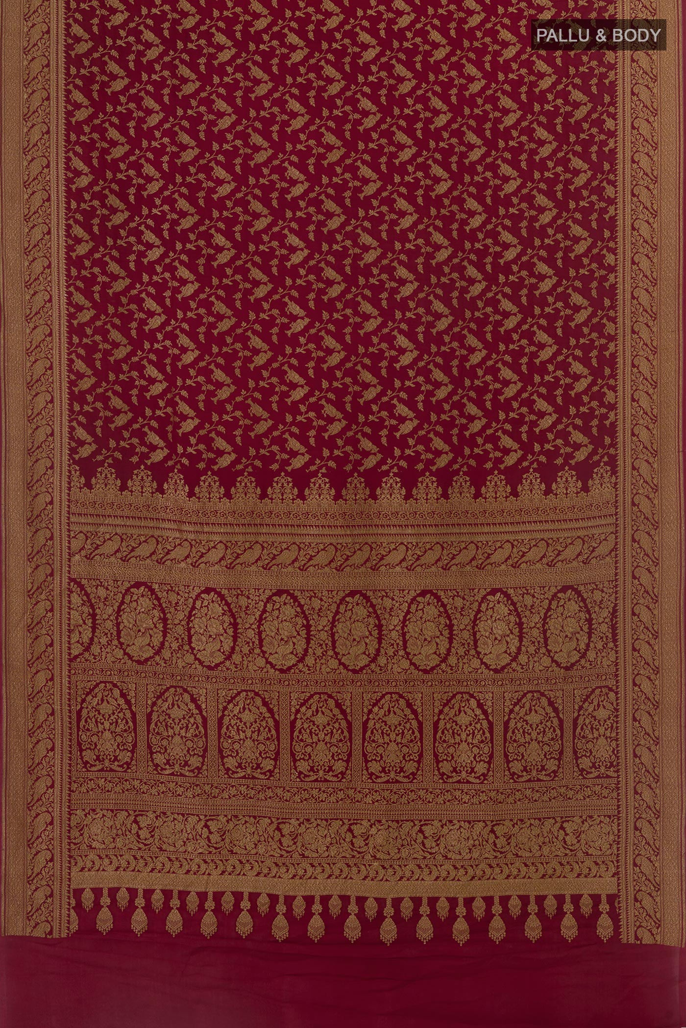 Flat view of Maroon Banarasi Georgette Saree with Zari Brocade on the body and Zari Border. 