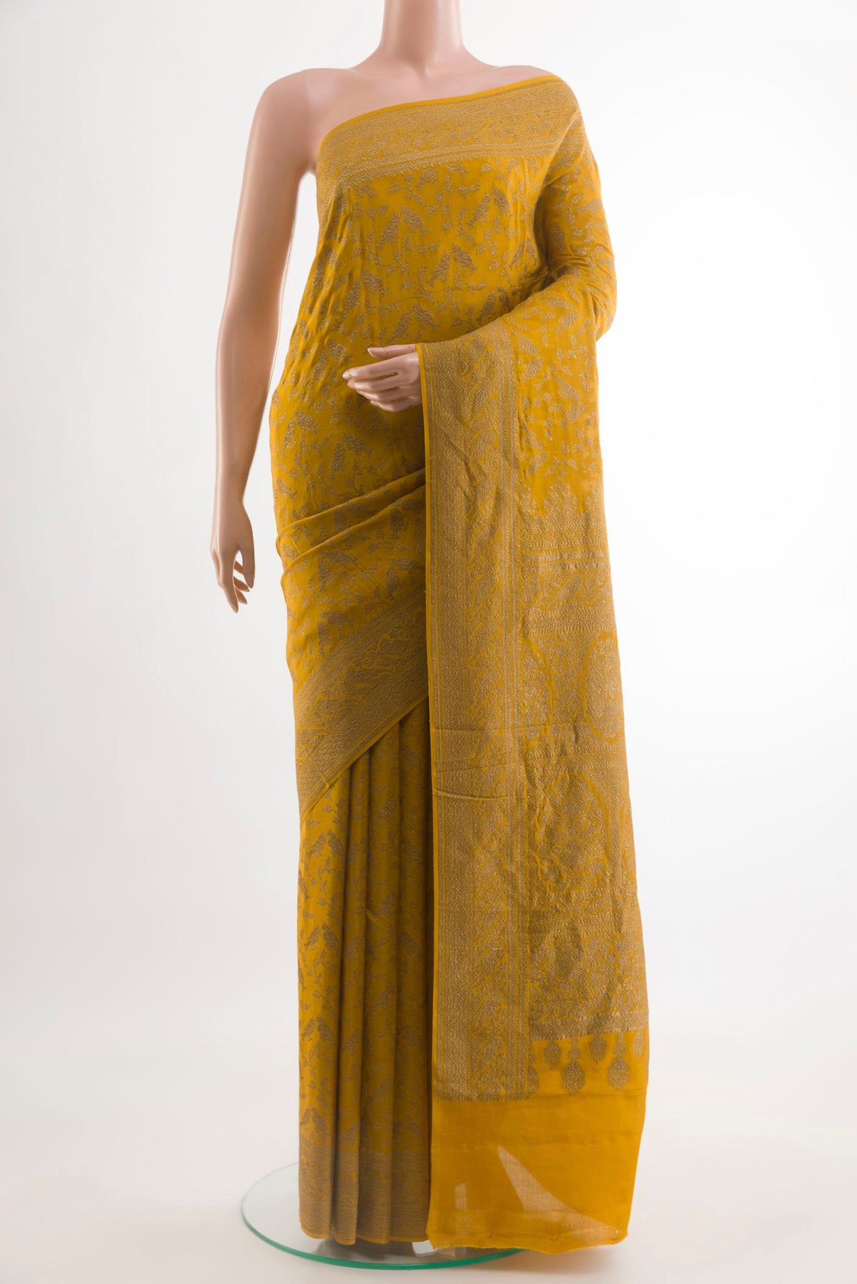 Mustard Banarasi Georgette Saree with Zari Brocade on the body and Zari Border.  displayed on a mannequin