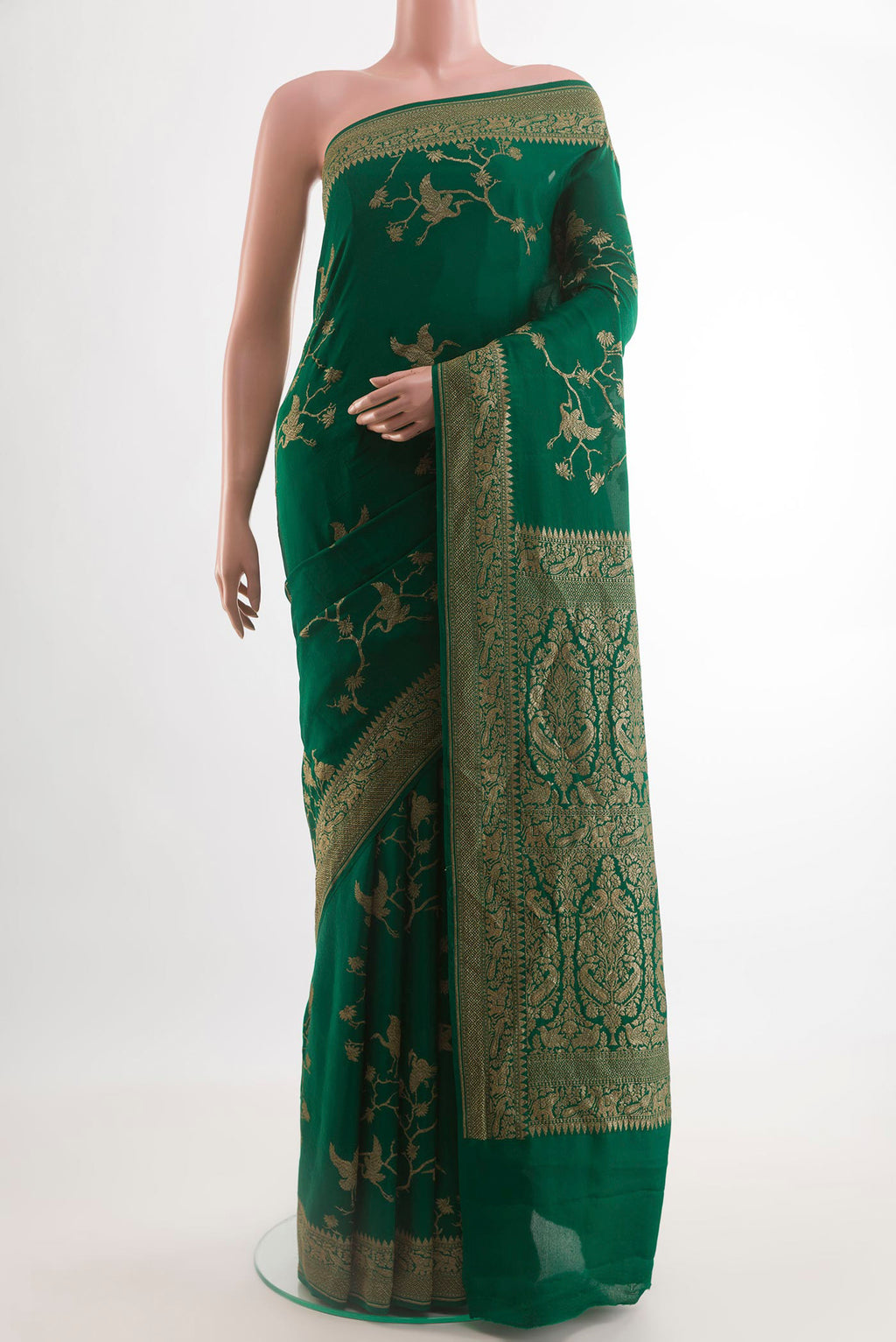 Bottle Green Banarasi Georgette Saree with Zari Brocade on the body and Zari Border.  displayed on a mannequin