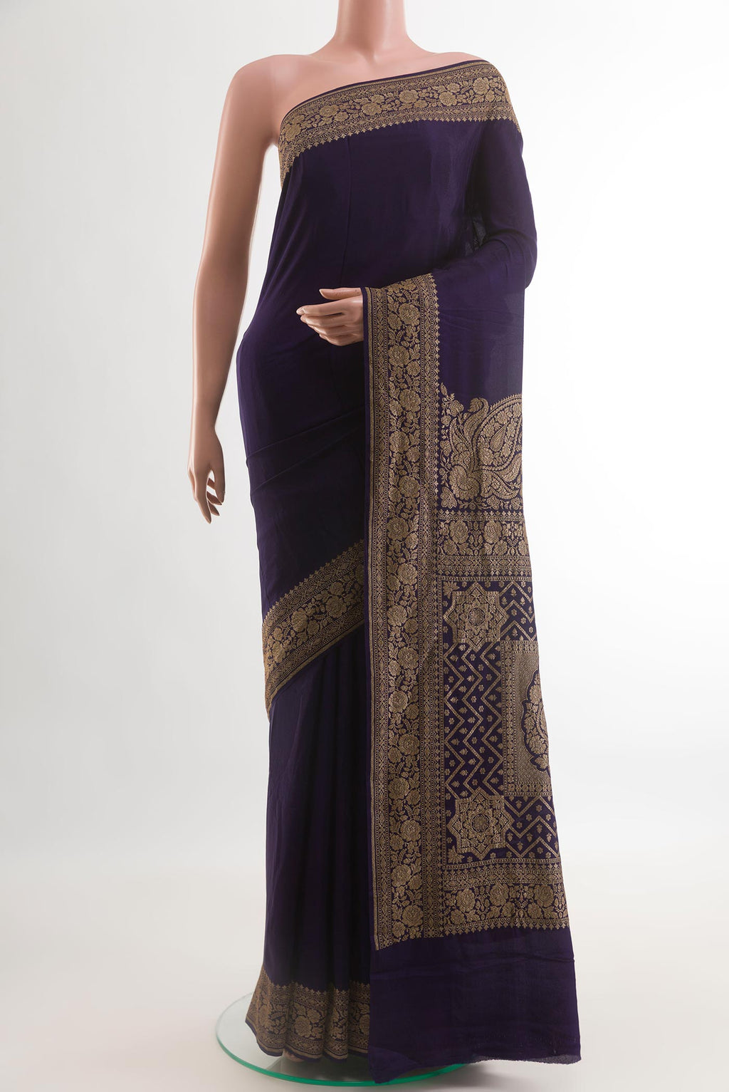 Navy Blue Banarasi Georgette Saree with Plain Body and Zari Border.  displayed on a mannequin