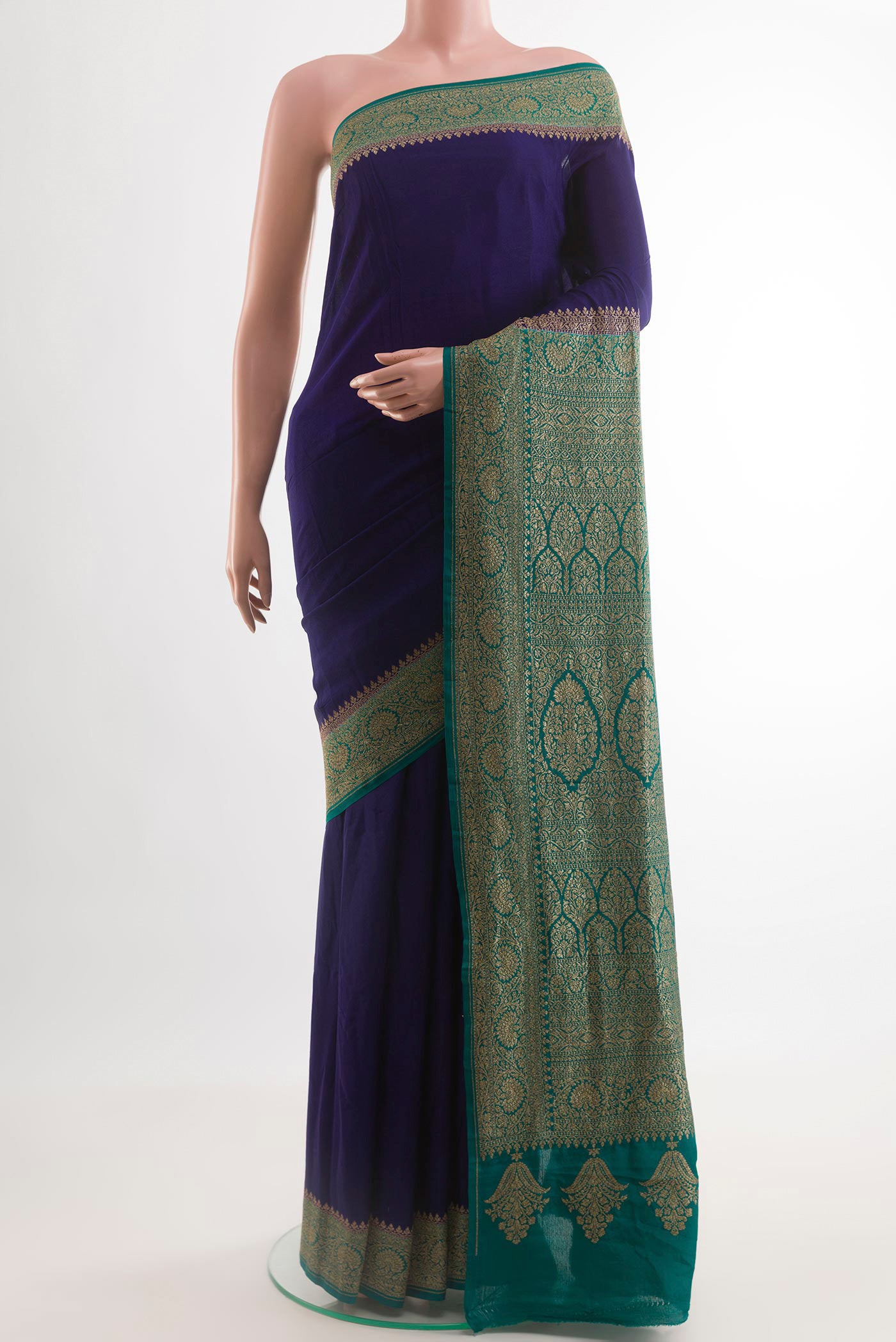 Navy Blue Banarasi Georgette Saree with Plain Body and Zari Border.  displayed on a mannequin