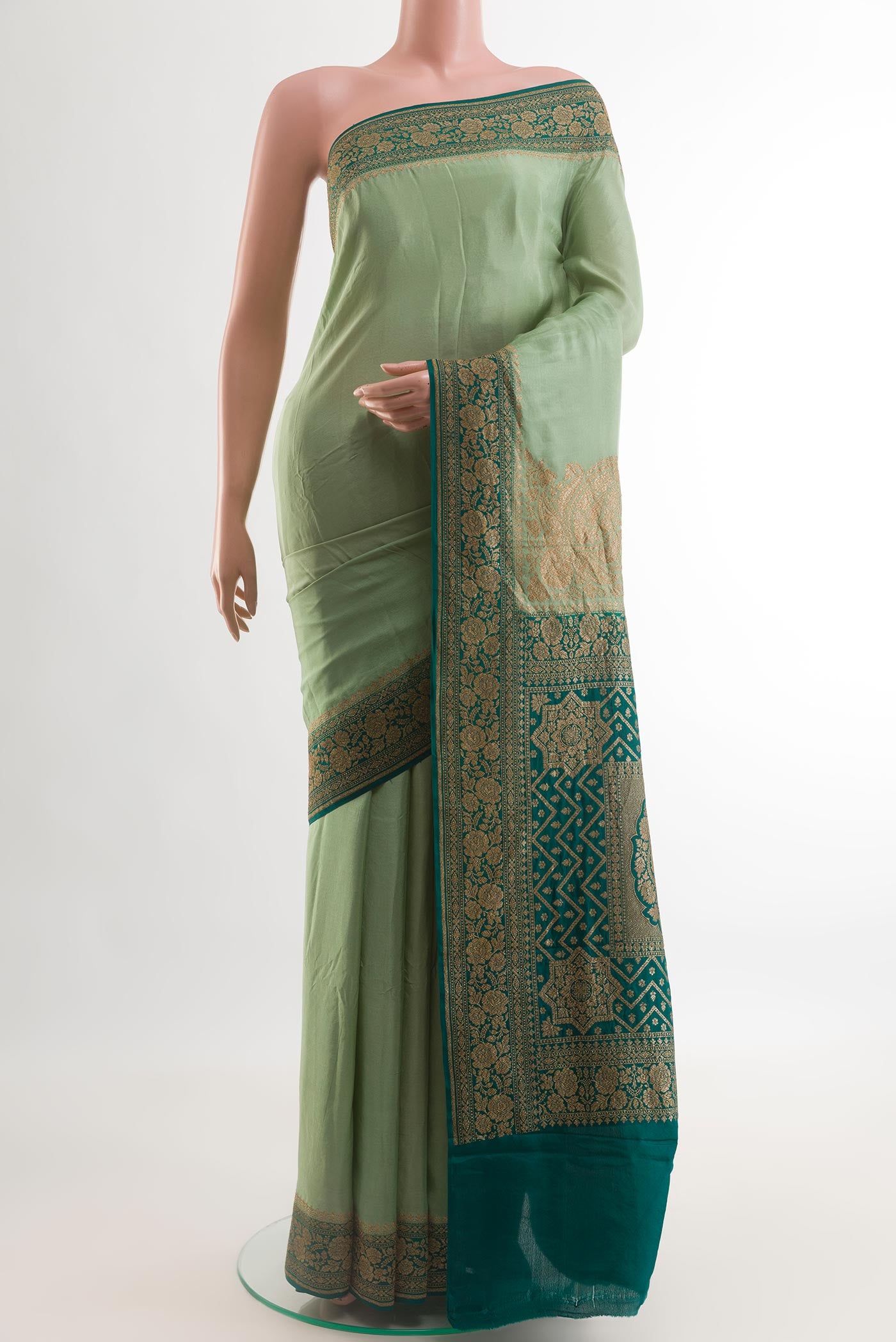 Green Banarasi Georgette Saree with Plain Body and Zari Border.  displayed on a mannequin