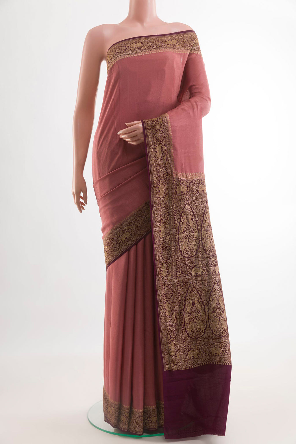 Coral Banarasi Georgette Saree with Plain Body and Zari Border.  displayed on a mannequin