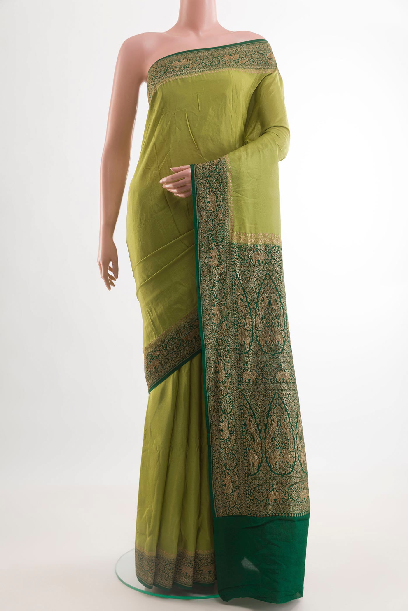 Light Green Banarasi Georgette Saree with Plain Body and Zari Border.  displayed on a mannequin