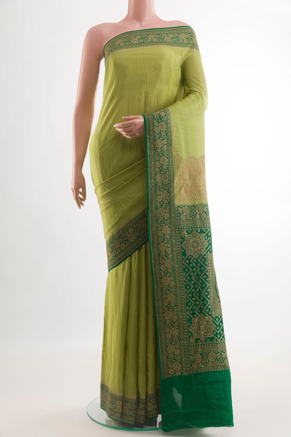 Light Green Banarasi Georgette Saree with Plain Body and Zari Border.  displayed on a mannequin