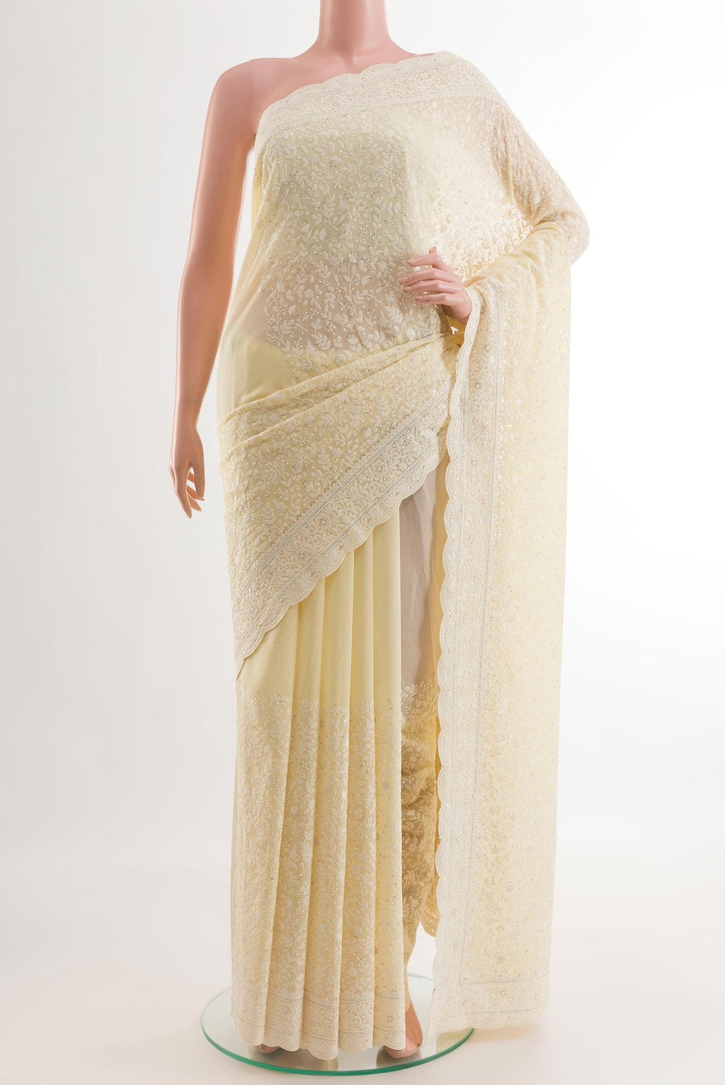 Lemon Yellow Blended Georgette Saree with Embroidery on the body and Embroidery Border.  displayed on a mannequin