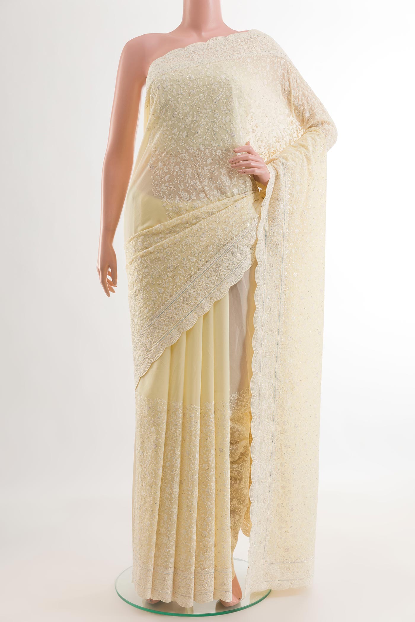 Lemon Yellow Blended Georgette Saree with Embroidery on the body and Embroidery Border.  displayed on a mannequin