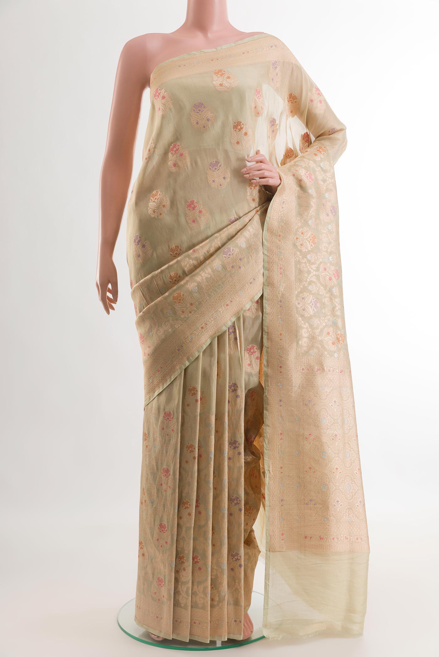 Light Green Banarasi Kora Silk Saree with Zari Brocade on the body and Zari Border.  displayed on a mannequin