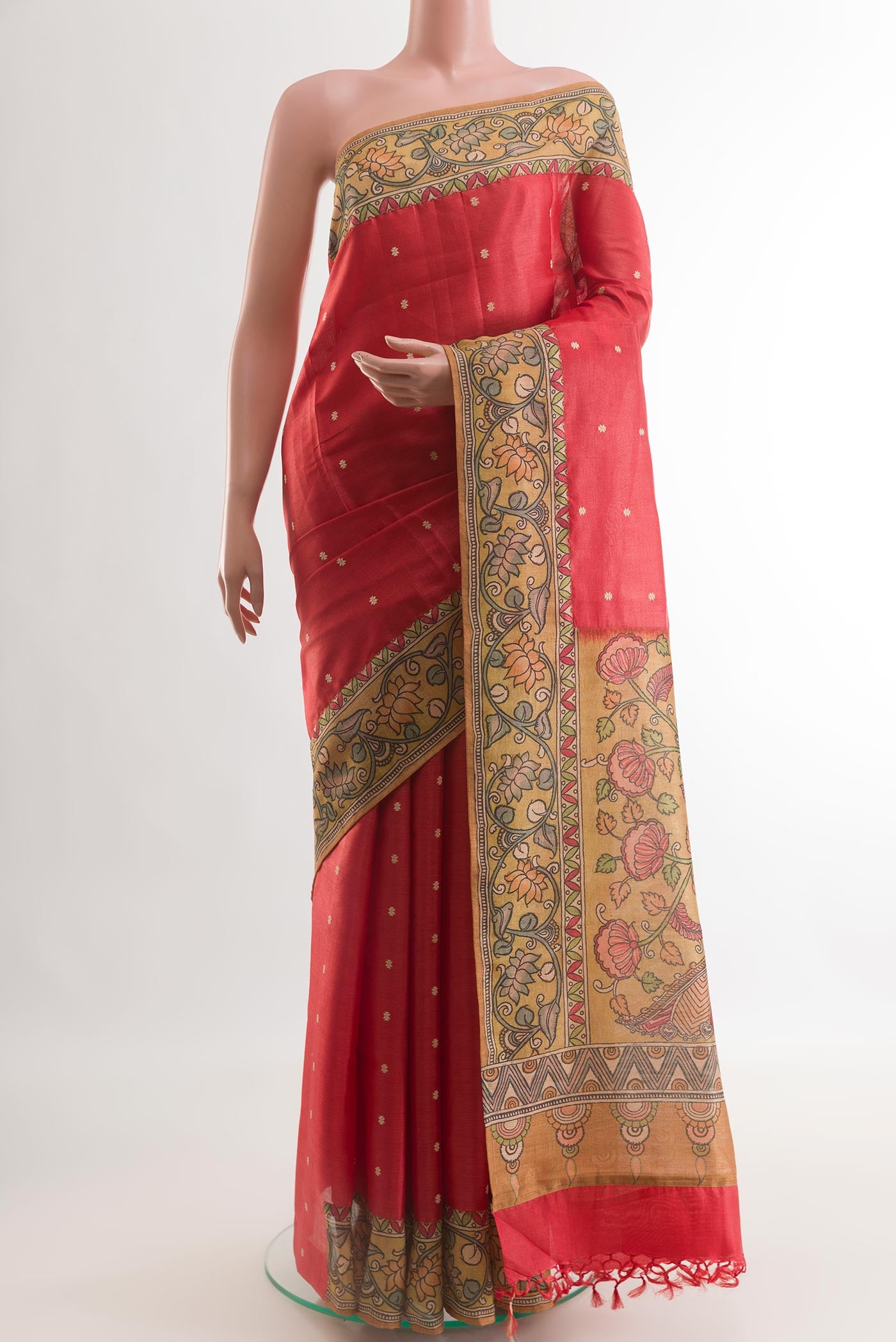 Red Tussar Silk Saree with Embroidery on the body and Printed Border.  displayed on a mannequin