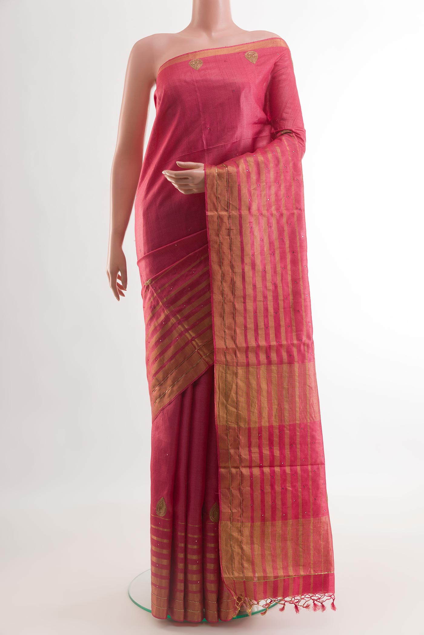 Pink Tussar Silk Saree with Embroidery on the body and Embroidery Border.  displayed on a mannequin