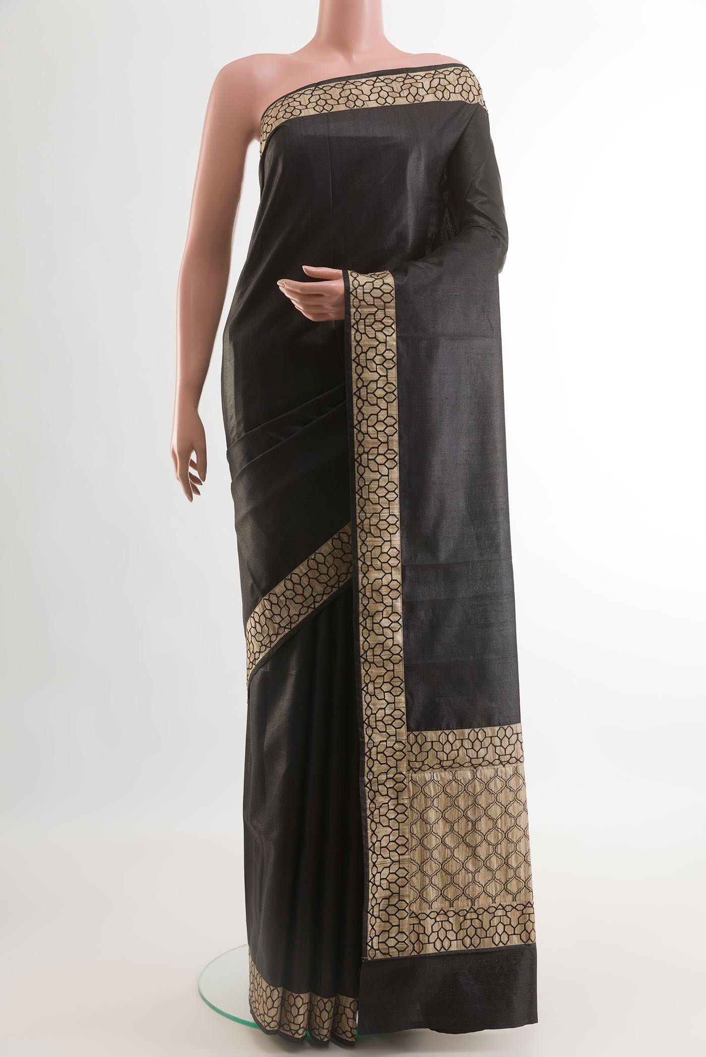 Black Tussar Silk Saree with Plain Body and Fancy Border.  displayed on a mannequin