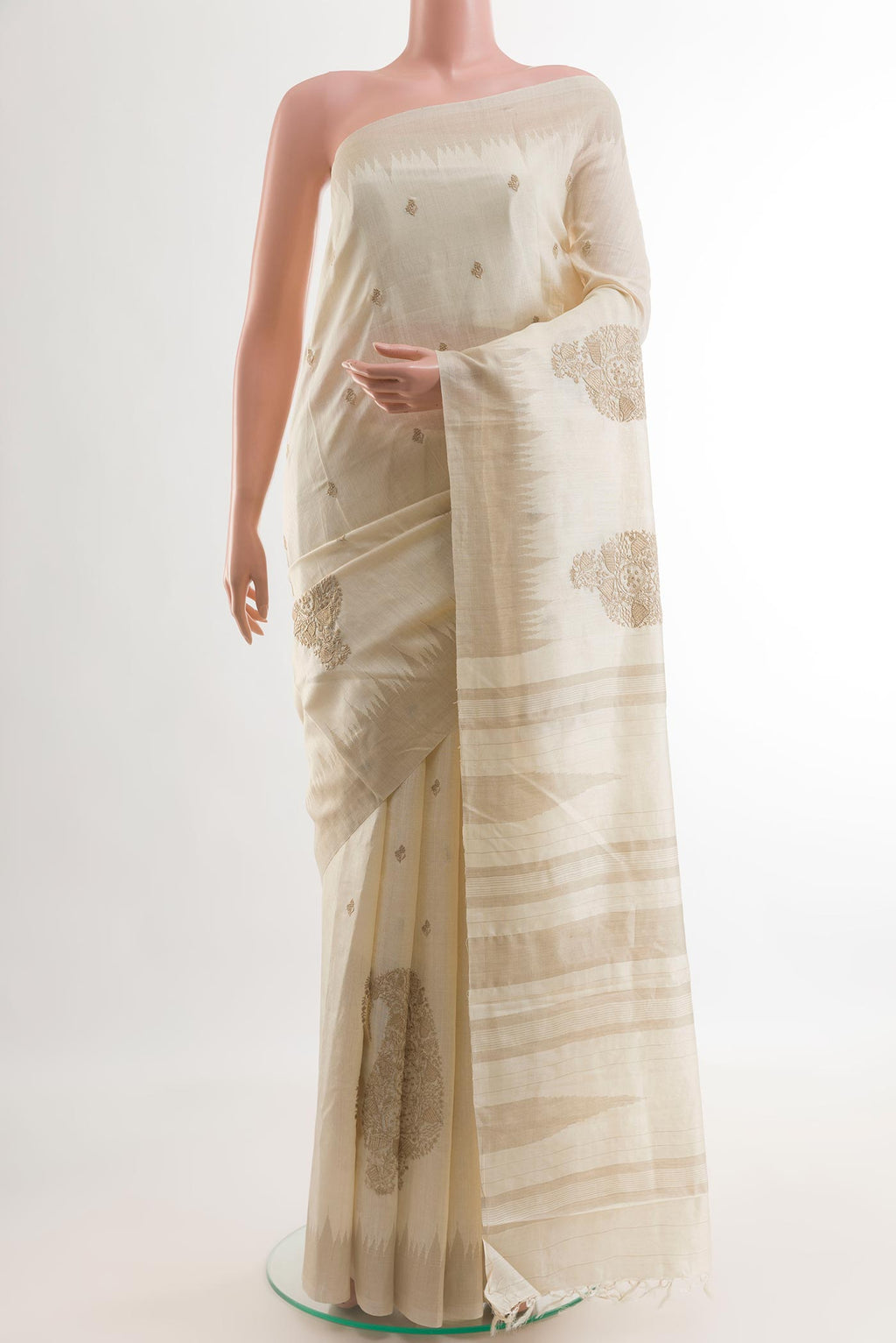 Cream Tussar Silk Saree with Embroidery on the body and Embroidery Border.  displayed on a mannequin