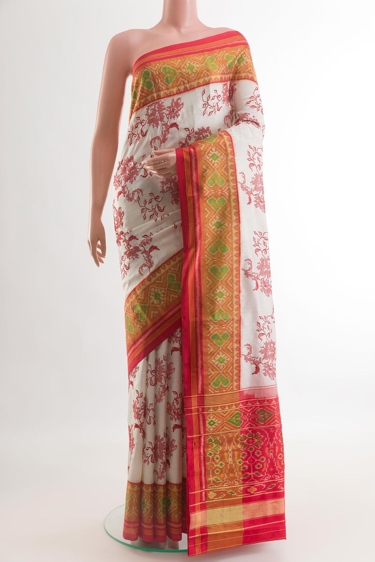 Beige Pochampally Silk Saree with Embroidery on the body and Ikat Border.  displayed on a mannequin
