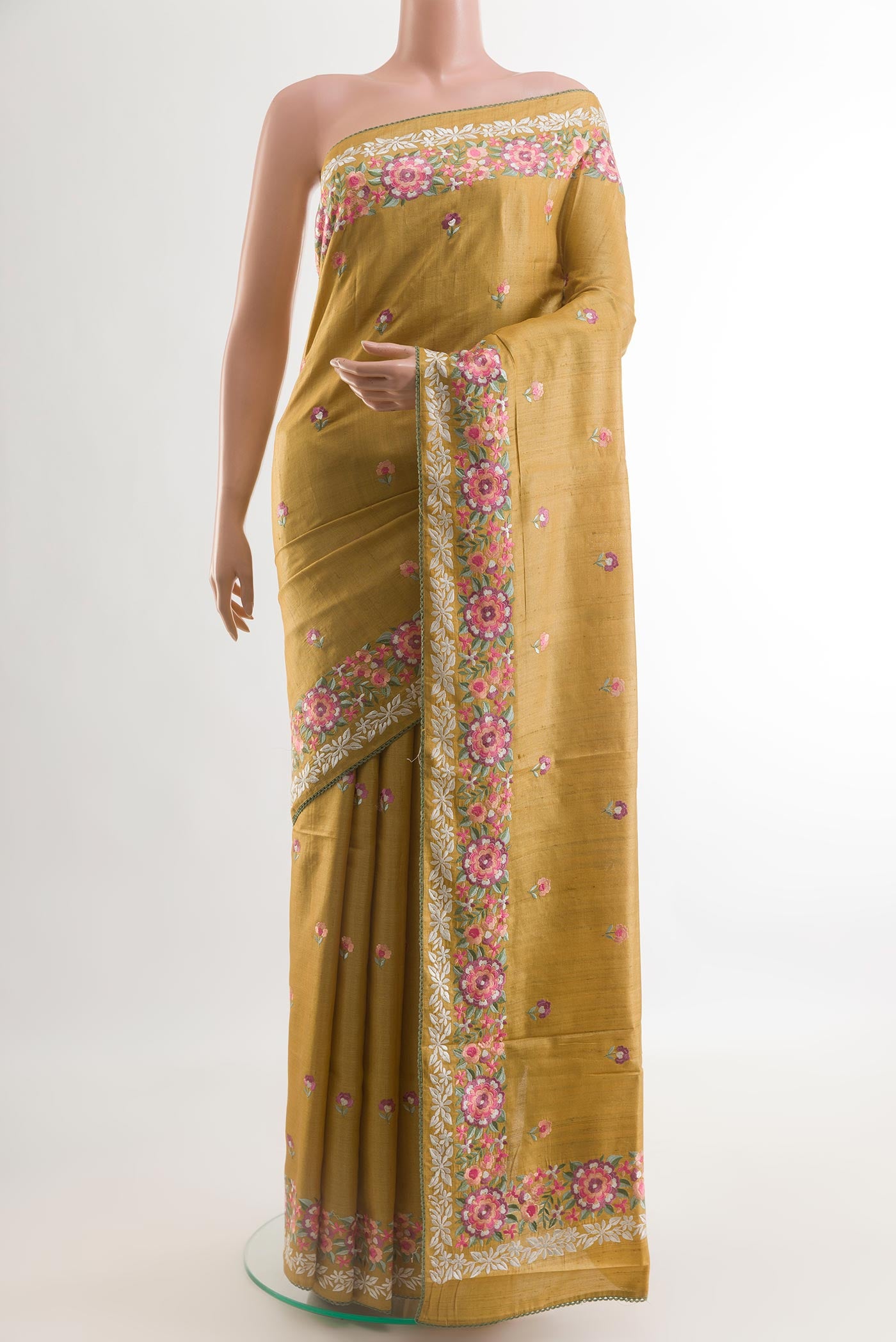 Mustard Tussar Silk Saree with Embroidery on the body and Embroidery Border.  displayed on a mannequin
