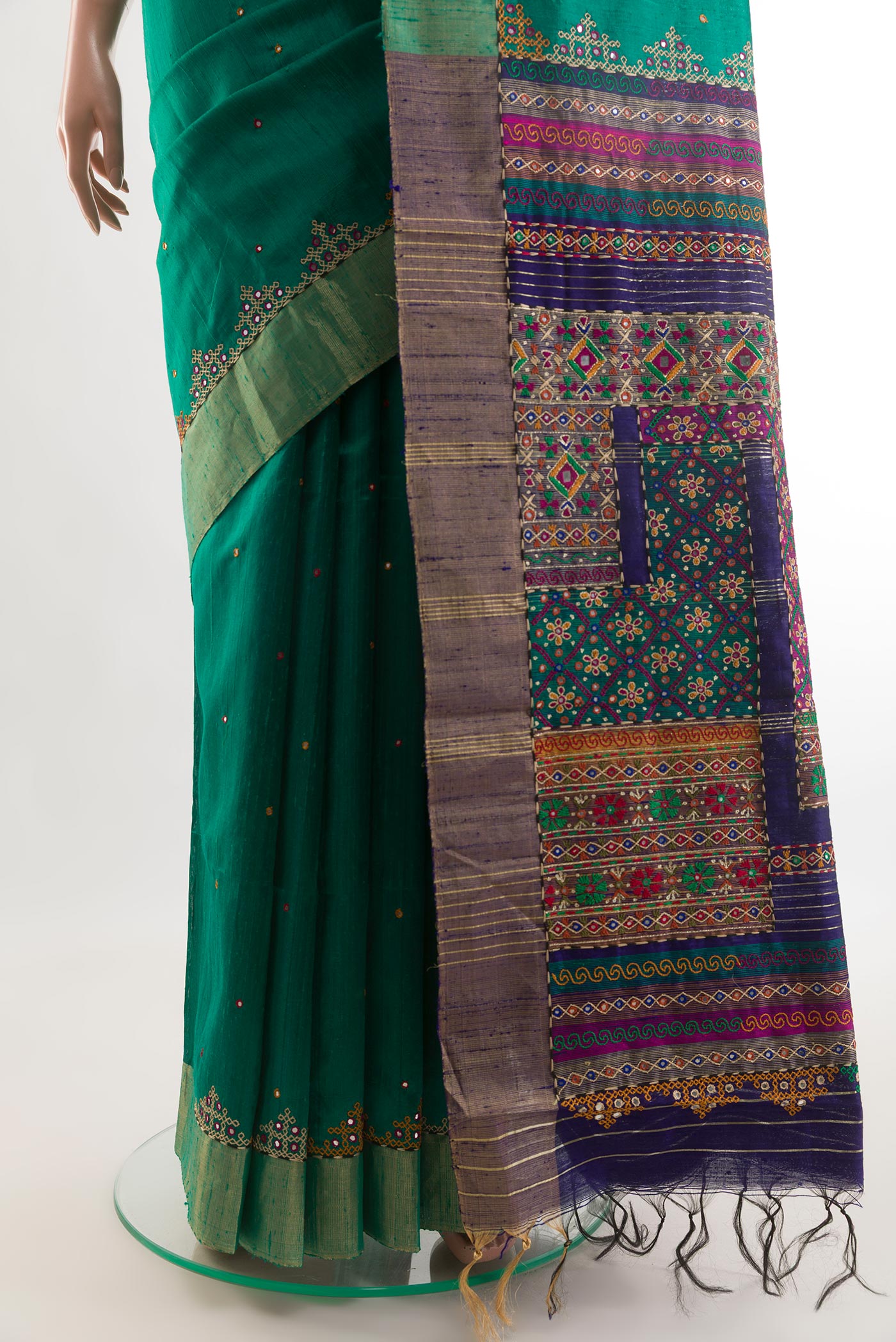 Pleats and pallu of Green Tussar Silk Saree with Embroidery on the body and Embroidery Border. 