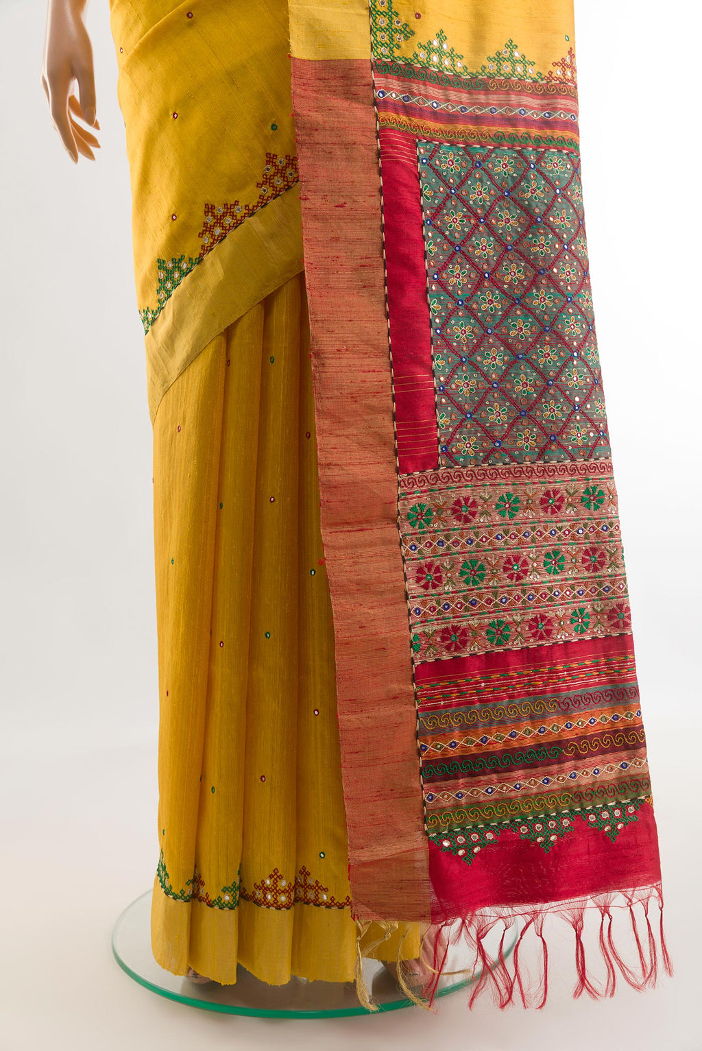 Pleats and pallu of Yellow Tussar Silk Saree with Embroidery on the body and Embroidery Border. 