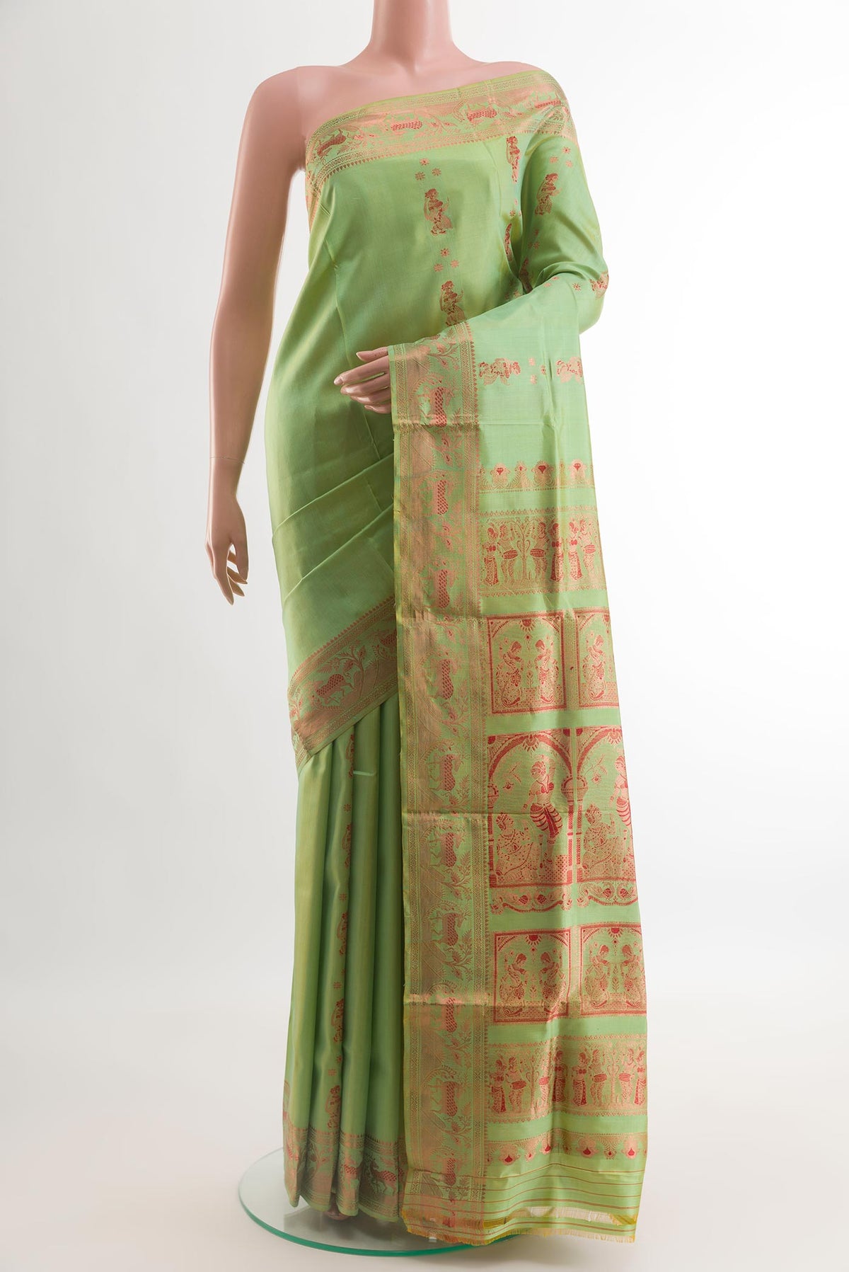 Green Baluchari Silk Saree with Zari Butta on the body and Zari Border.  displayed on a mannequin