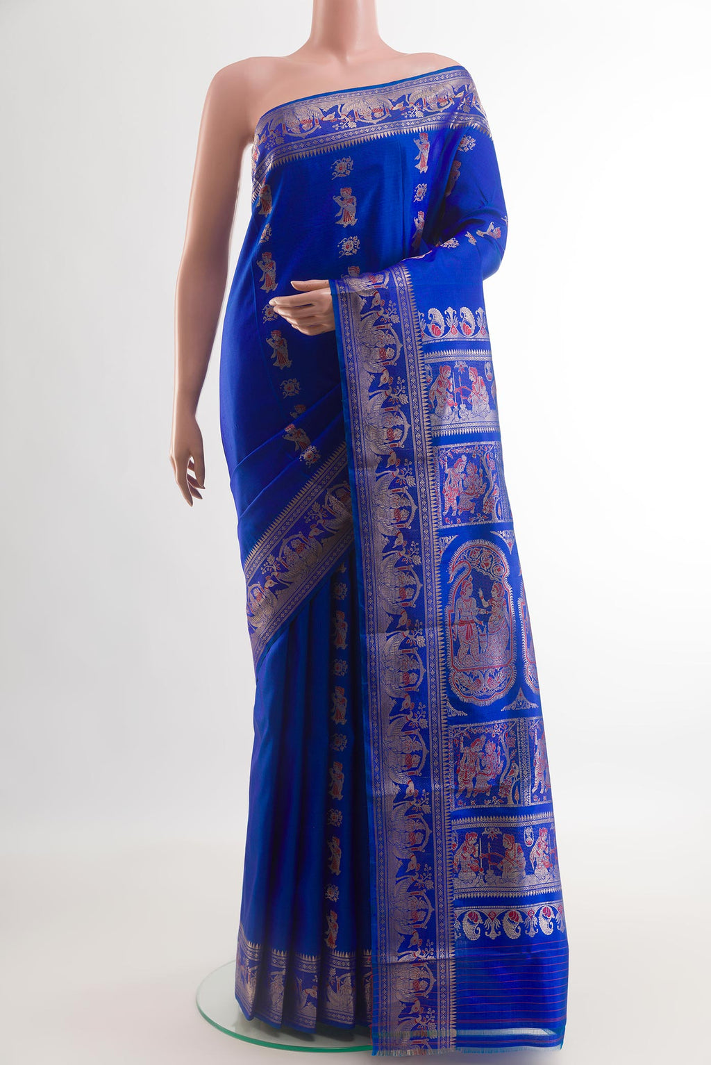 Royal Blue Baluchari Silk Saree with Zari And Thread Butta on the body and Zari Border.  displayed on a mannequin