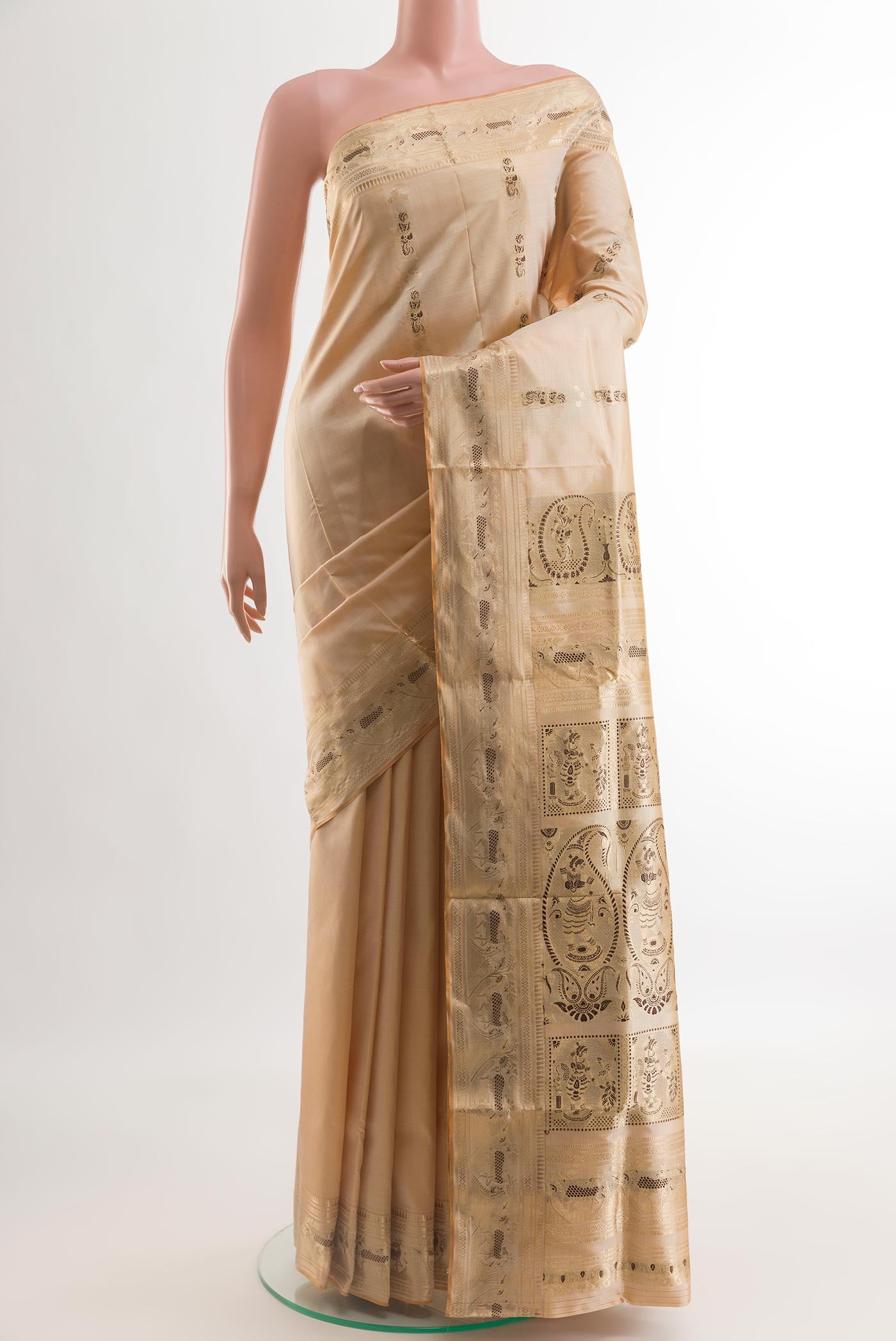Sandal Baluchari Silk Saree with Zari And Thread Butta on the body and Zari Border.  displayed on a mannequin