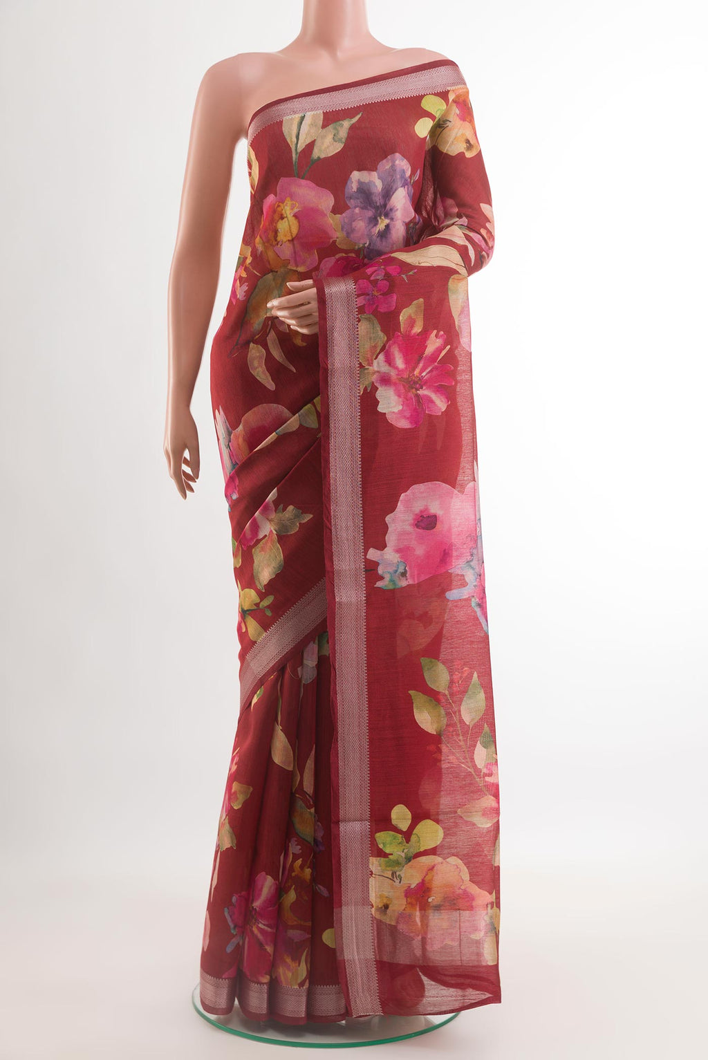 Maroon Tussar Silk Saree with Floral Print on the body and Zari Border.  displayed on a mannequin