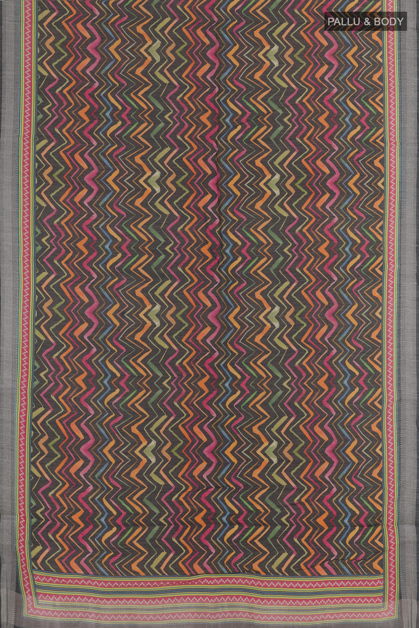 Flat view of Black Tussar Silk Saree with Printed design on the body and Zari Border. 