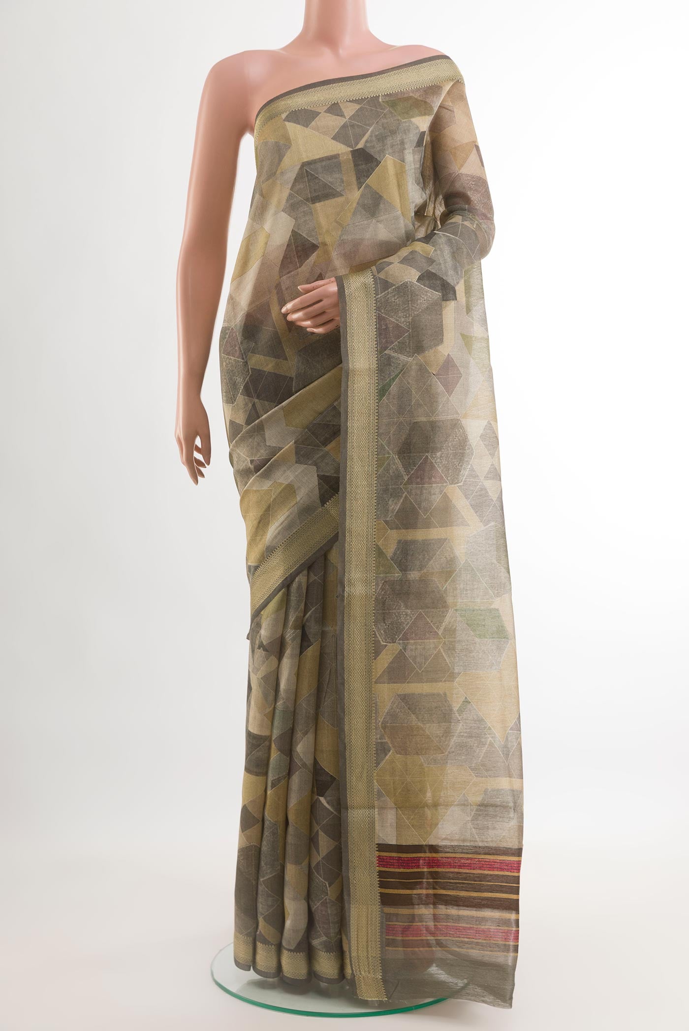 Multi Color Tussar Silk Saree with Geometric Print on the body and Zari Border.  displayed on a mannequin