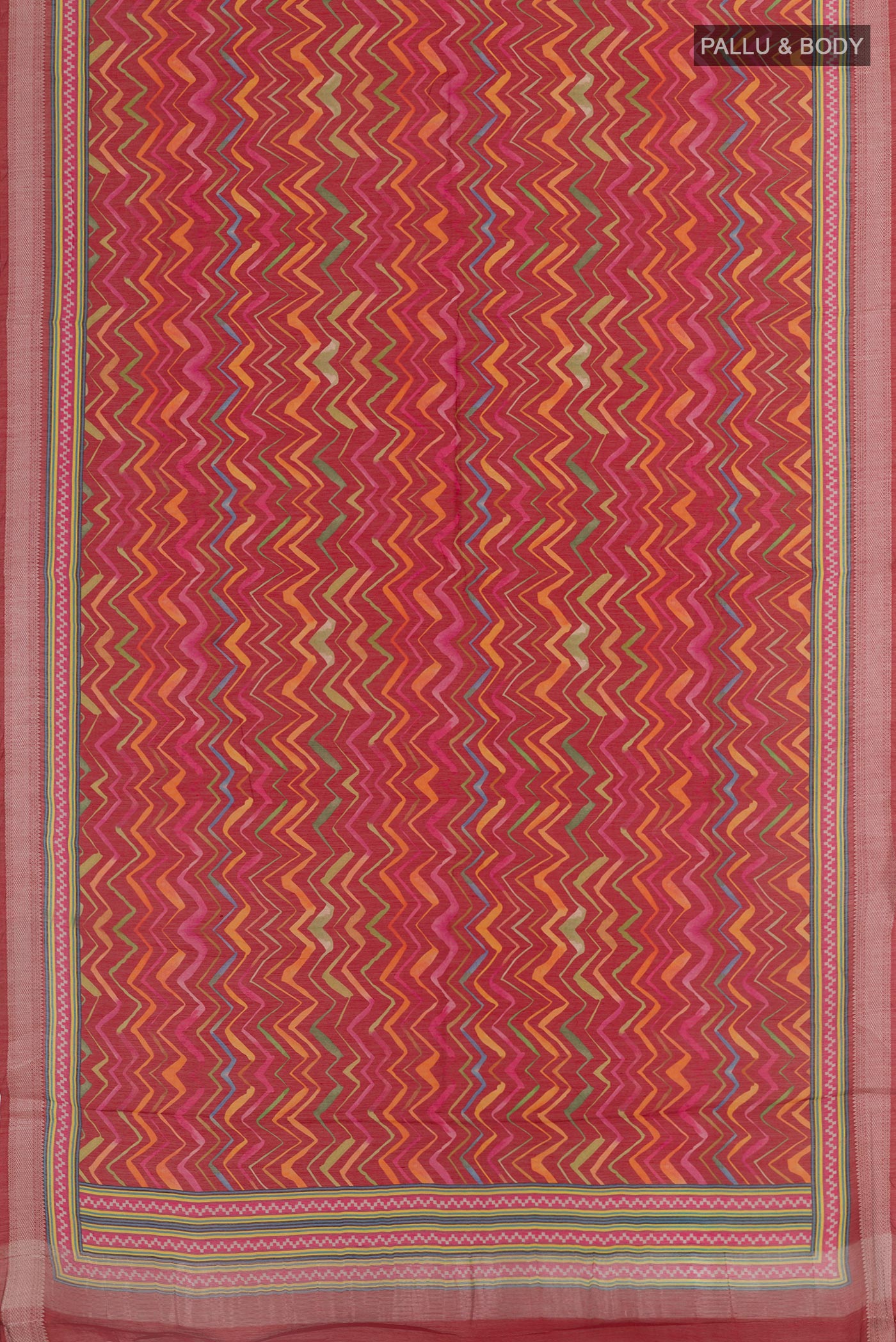Flat view of Red Tussar Saree with Printed design on the body and Zari Border. 