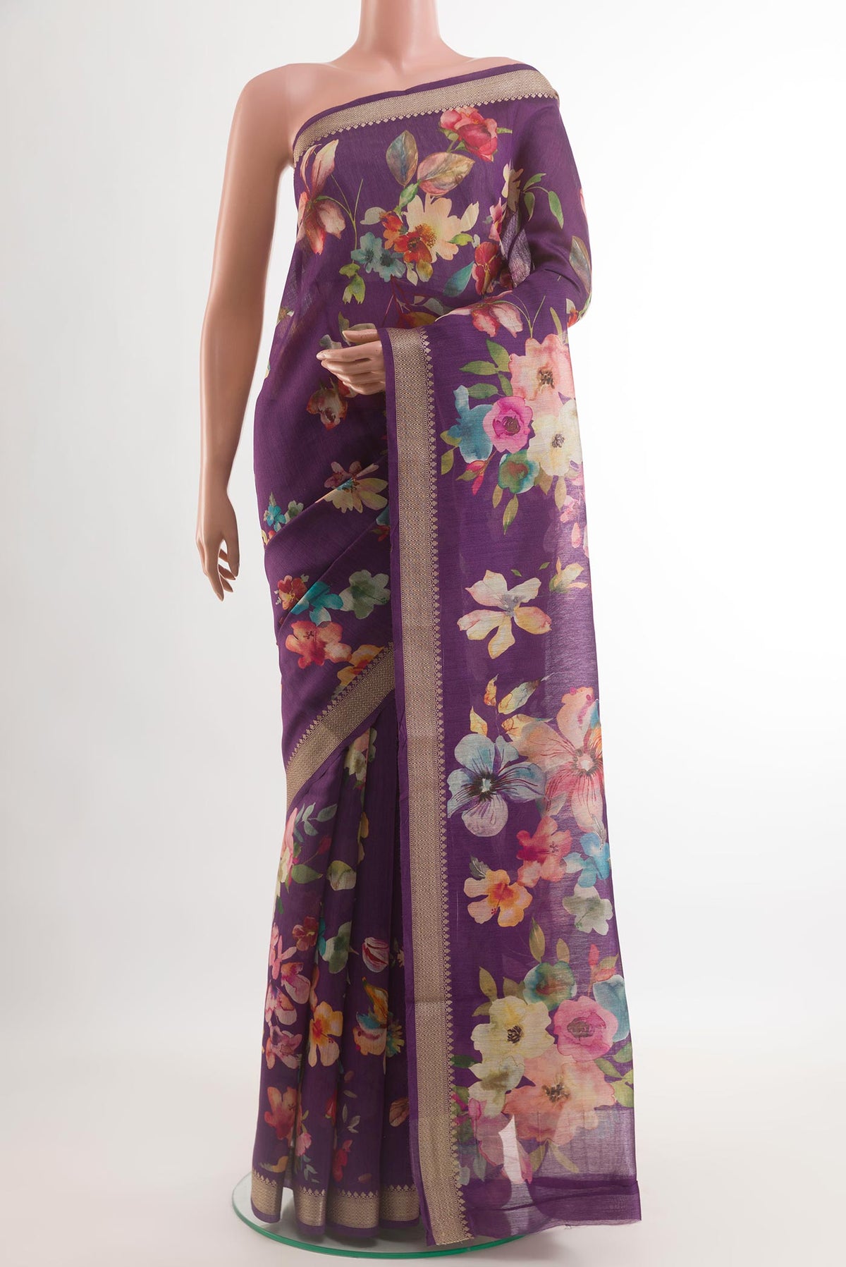 Violet Tussar Silk Saree with Floral Print on the body and Zari Border.  displayed on a mannequin