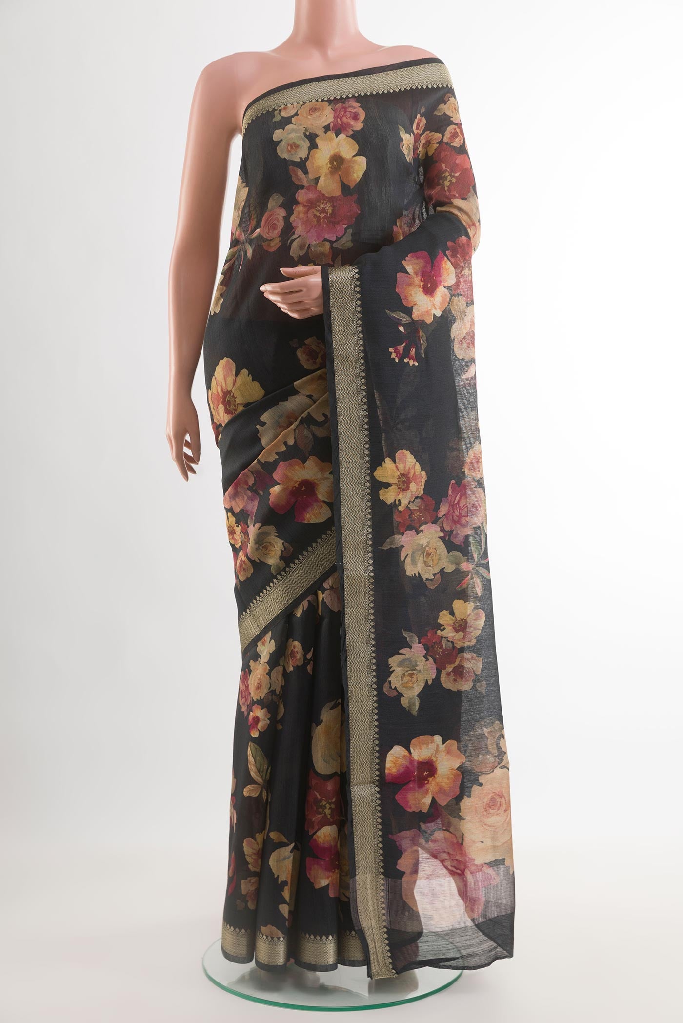 Black Tussar Saree with Floral Print on the body and Zari Border.  displayed on a mannequin