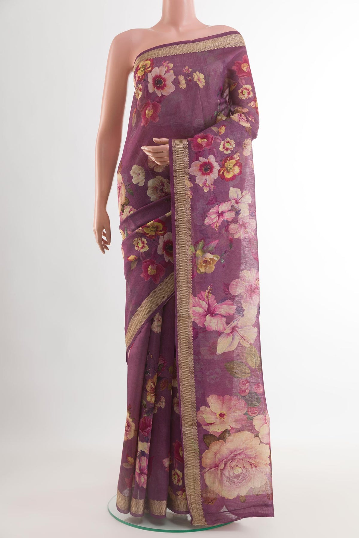 Purple Tussar Silk Saree with Floral Print on the body and Zari Border.  displayed on a mannequin