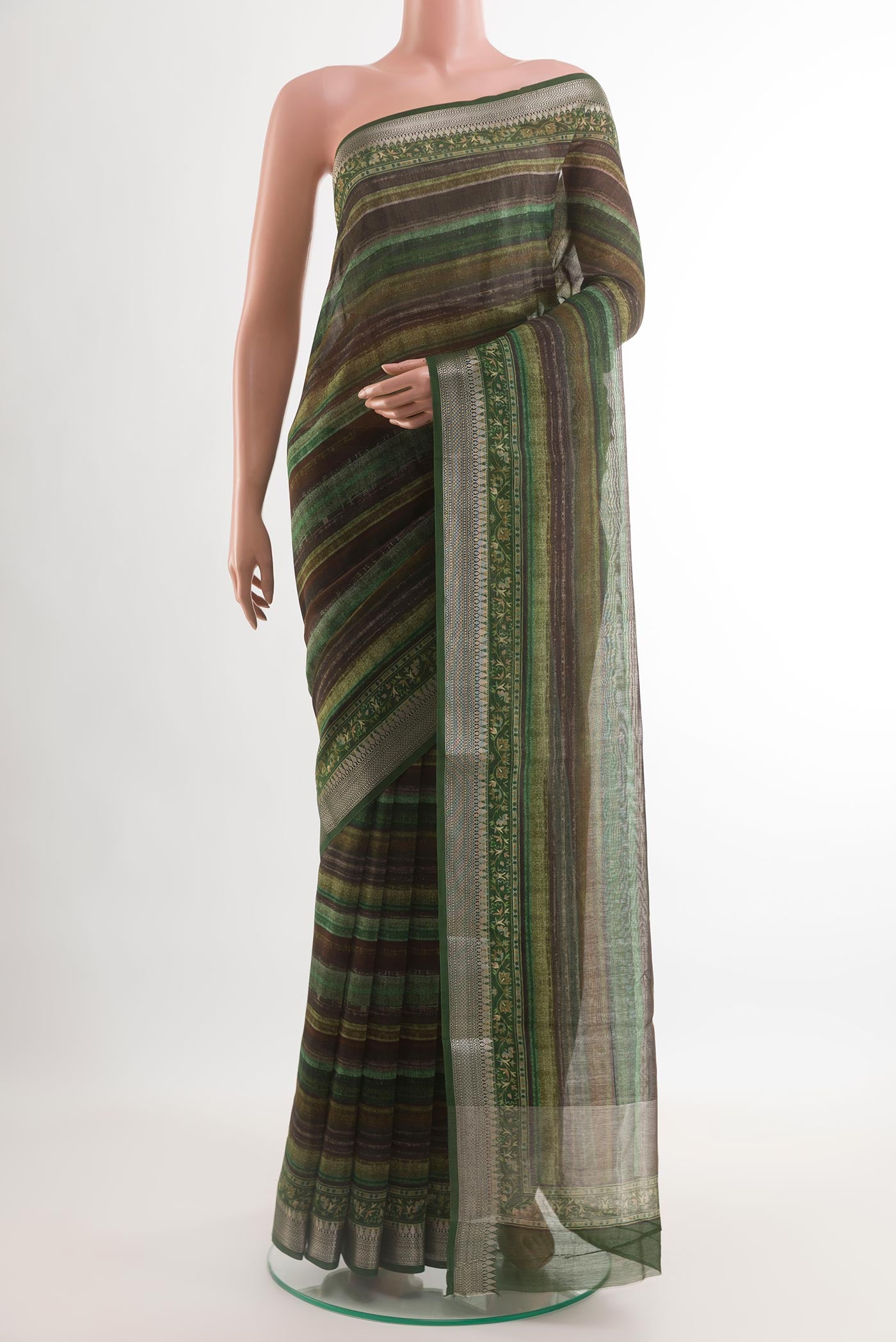 Multi Color Tussar Silk Saree with Printed design on the body and Zari Border.  displayed on a mannequin