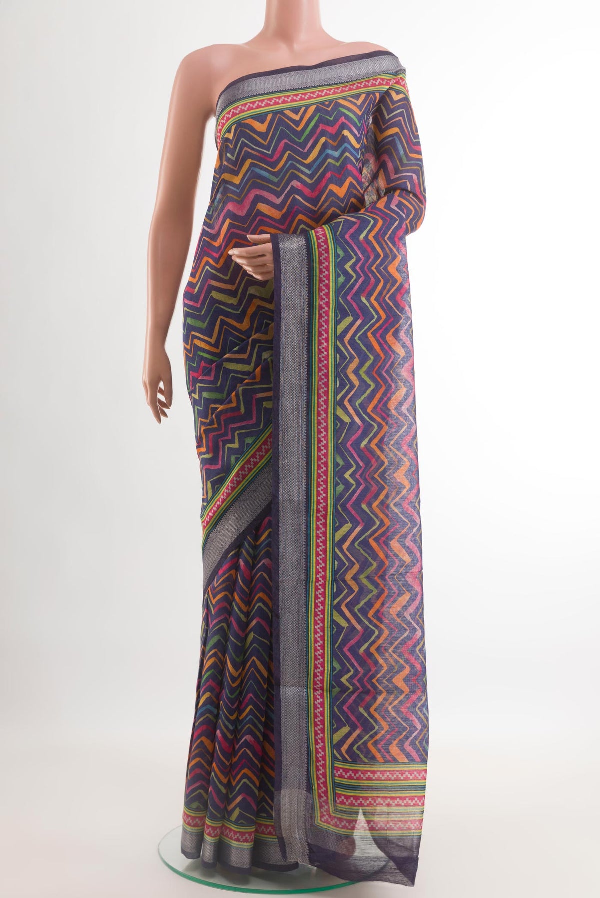 Blue Tussar Silk Saree with Printed design on the body and Zari Border.  displayed on a mannequin